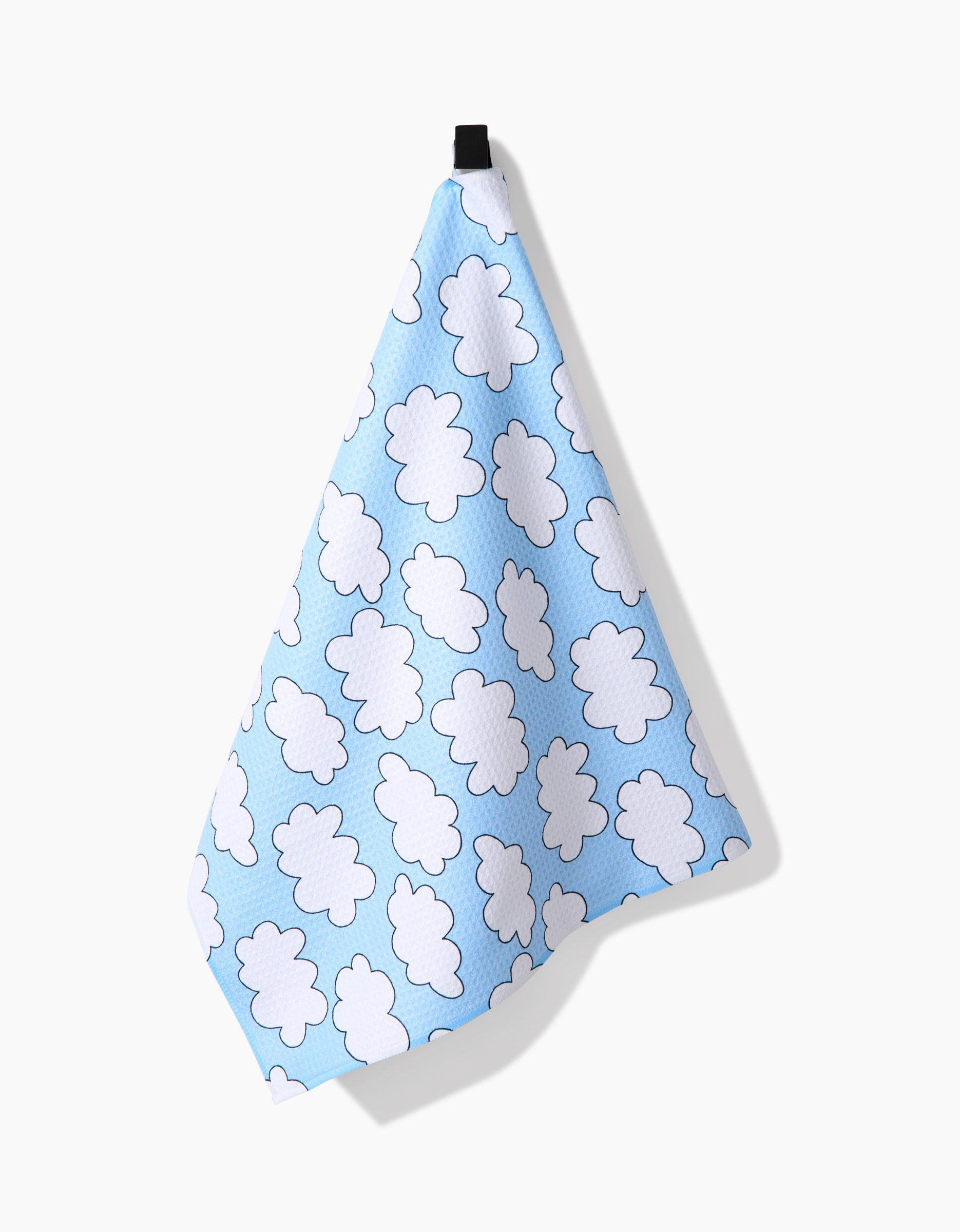 The Mindfulnice Silver Linings towel is blue with white, fluffy clouds, crafted from ultra-absorbent Geoweave fabric and displayed against a plain white background.