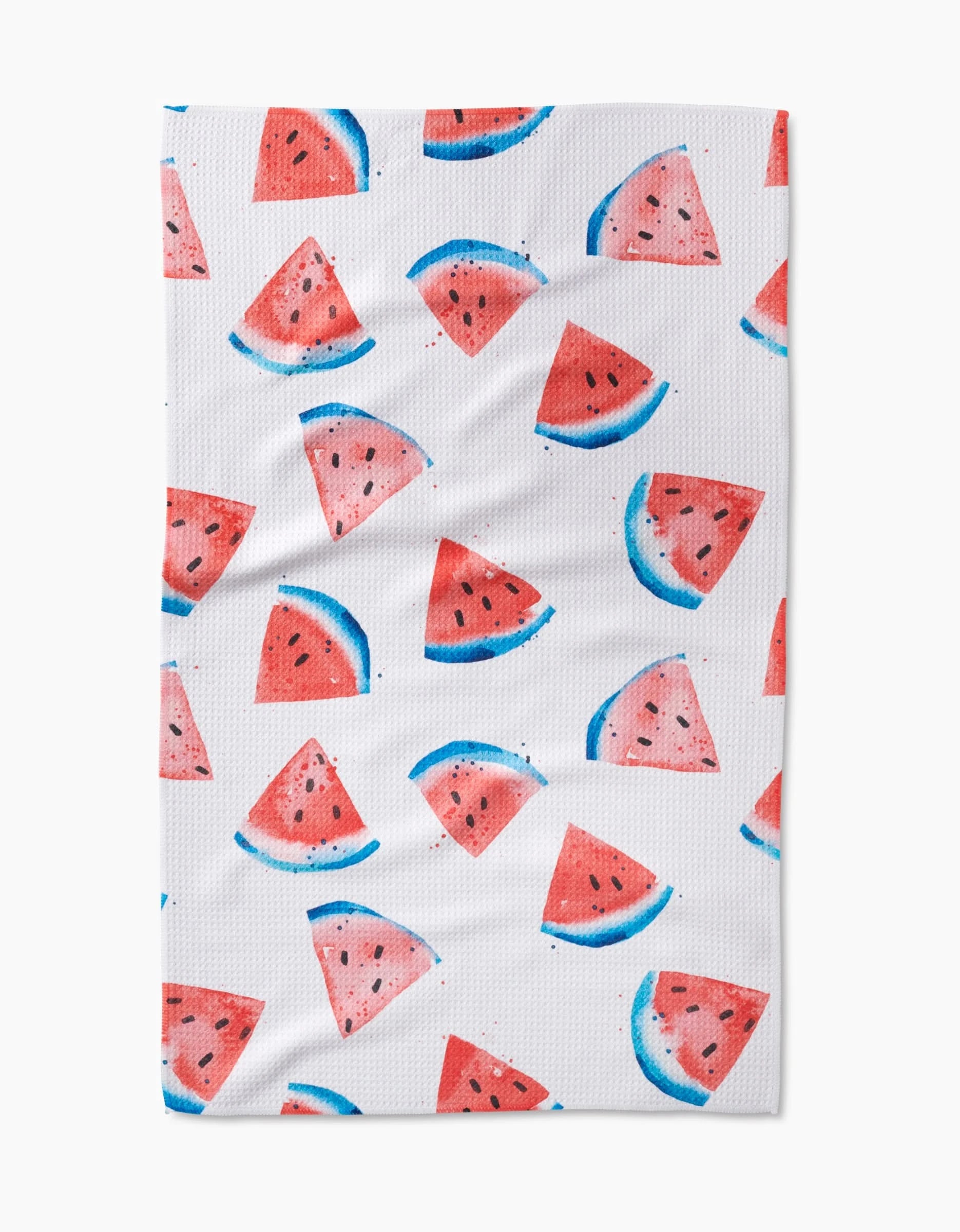 The Sweet Slice Of July is a white tea towel with watercolor-style watermelon wedges and semicircles, evenly scattered across the surface, and made from recycled materials.
