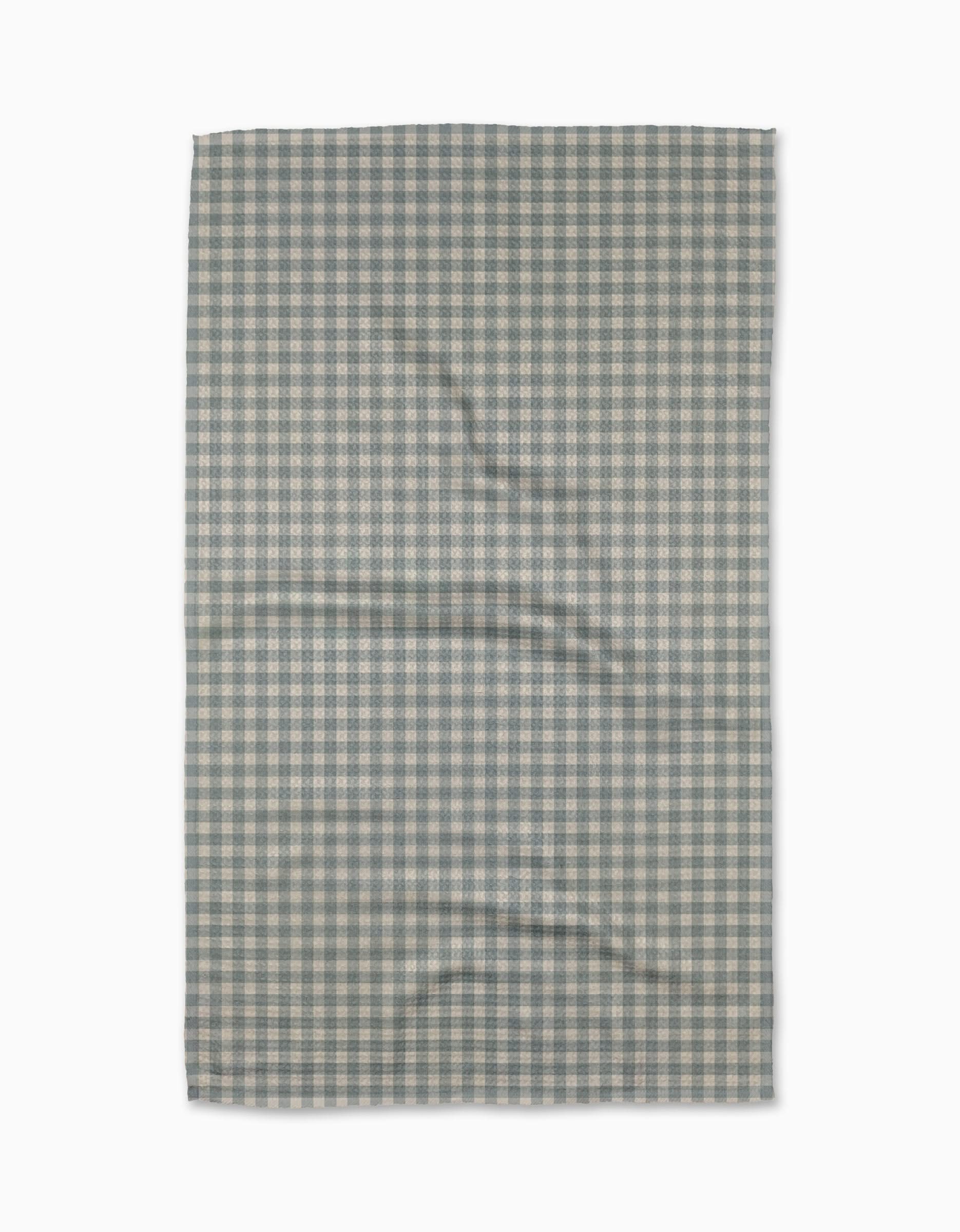 The Jenny Keller Tidepool Check is a rectangular recycled kitchen towel featuring a small blue and white gingham checkered pattern, slightly wrinkled and laid flat on a white background.