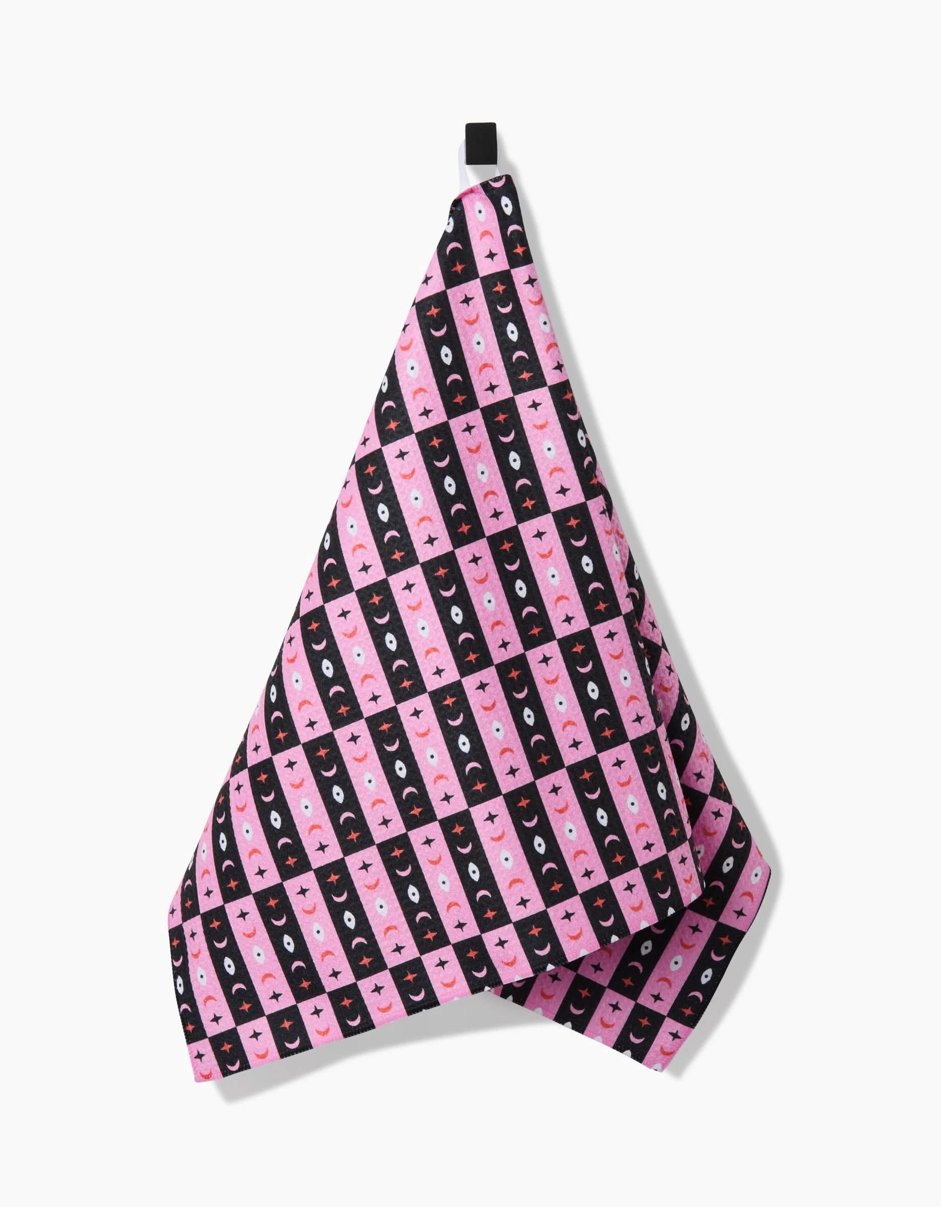 Laura Supnik’s Twinkling Eye is a quick-drying pink and black checkered tea towel made from recycled materials, with smiling cartoon faces and a black hanging loop, shown on a white background.