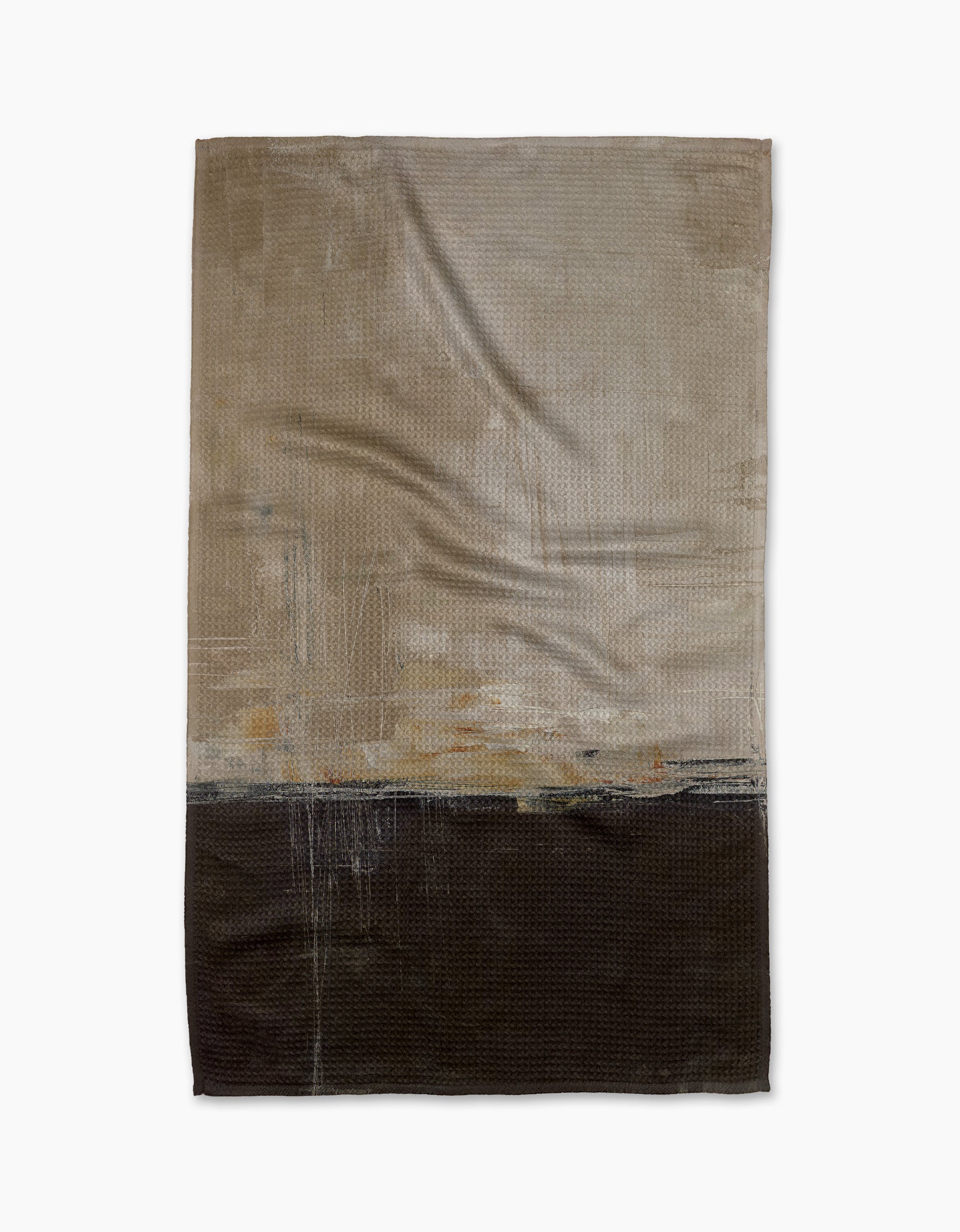 The Uncharted Territory tea towel by Jennifer Bouron features an abstract design with a light beige top and dark brown bottom, divided horizontally, plus subtle textured and painted details across its ultra-absorbent surface.