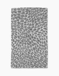 The Rachel Parker White Leaf Swirl tea towel features black leafy branches swirling in a hypnotic pattern on white, creating a dynamic, nature-inspired optical illusion that brings art and ultra-absorbent function to your kitchen.
