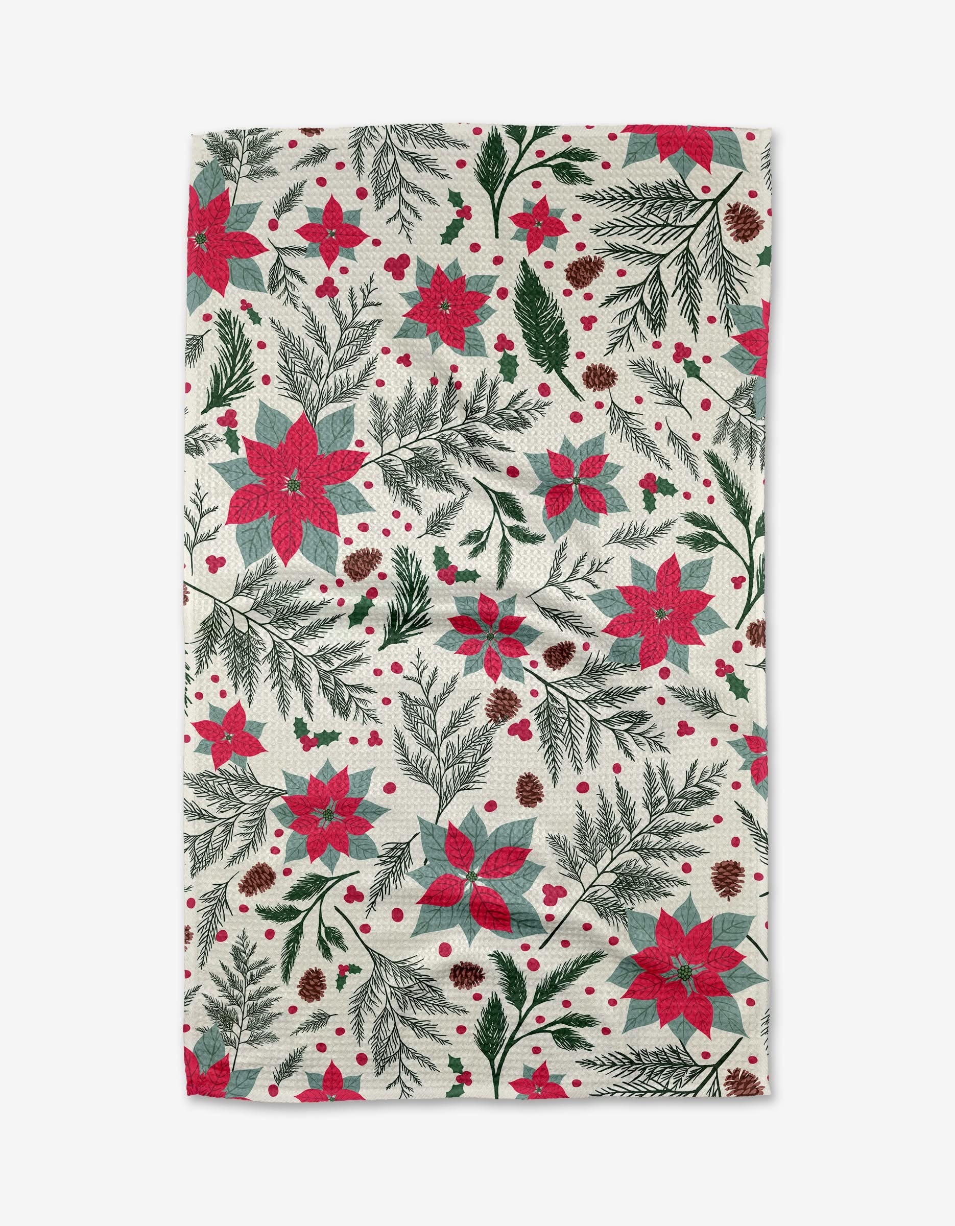 The Rebecca Bobko Woodland Poinsettia tea towel features a festive, dense design of red poinsettias, pine branches, pine cones, and berries on white. Made from ultra-absorbent material for both style and function.