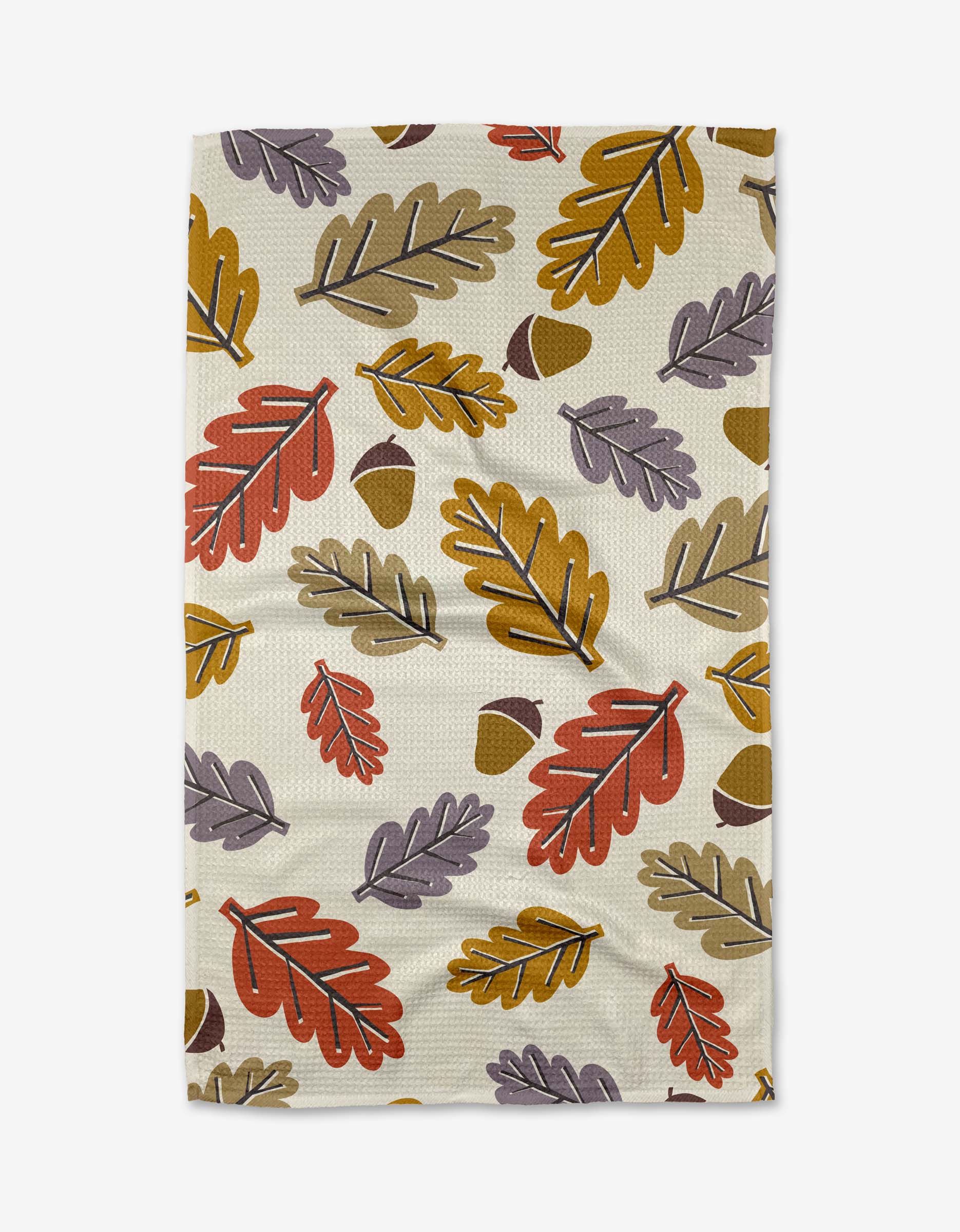 The Retro Leaves blanket by Lizzie Clark is made from recycled materials and features a repeating autumn leaf pattern in orange, yellow, purple, and brown acorns on a light beige background.