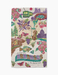 Geometry’s “Greetings From Arkansas” tea towel features vibrant illustrations of Arkansas symbols and “Greetings from ARKANSAS The Natural State.” Made from recycled materials for a cheerful, eco-friendly touch.