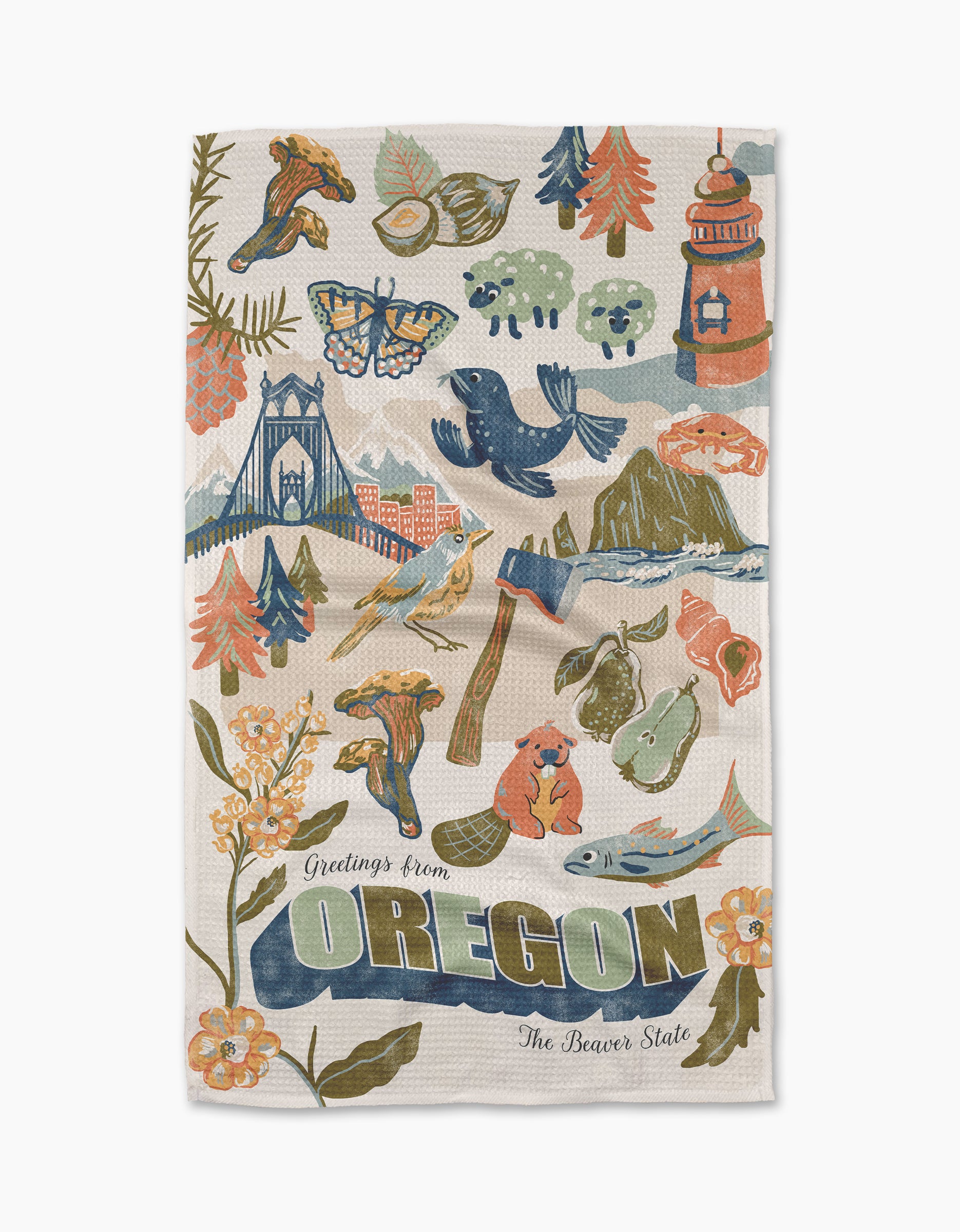 Geometry's "Greetings From Oregon" tea towel is eco-friendly and features recycled materials with Oregon icons—trees, mushrooms, a bridge, a sea lion—and the text “Greetings from OREGON The Beaver State.” Perfect for any kitchen.
