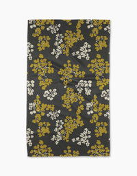 Geometry’s Sonnet Ember tea towel features a black background with mustard yellow and white floral clusters. Made from recycled materials, it’s a stylish and eco-friendly choice for your kitchen.