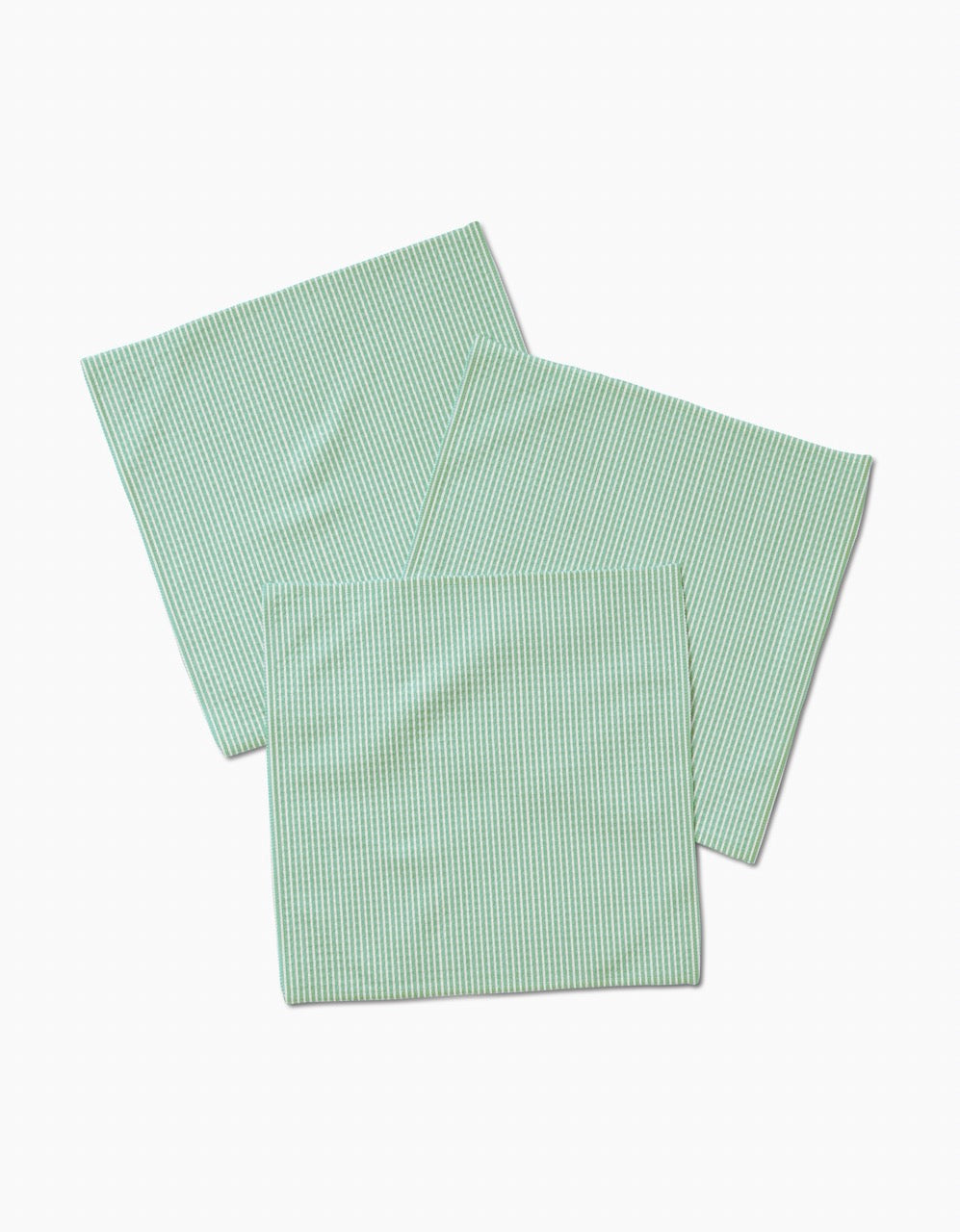 Three light green GEOMETRY Half and Half washcloths with white stripes, made from ultra-absorbent Geoweave technology, are displayed overlapping on a white background.
