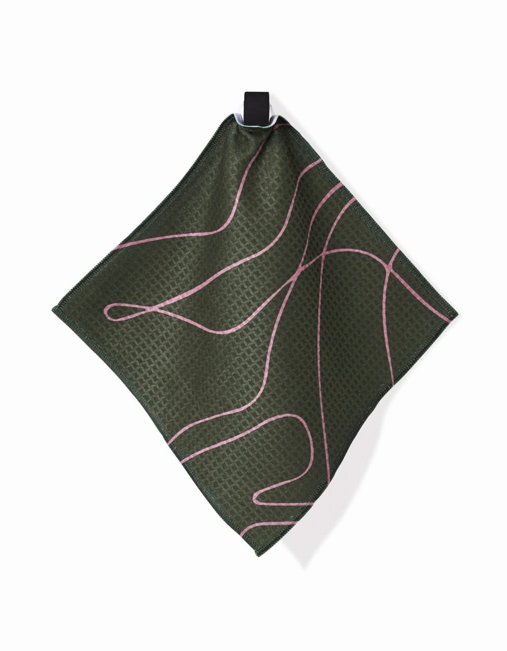 The GEOMETRY Olive Martini is a square, dark green handkerchief with thin wavy pink lines and a subtle texture, made from ultra-absorbent Geoweave fabric. It hangs by a black loop against a white background.