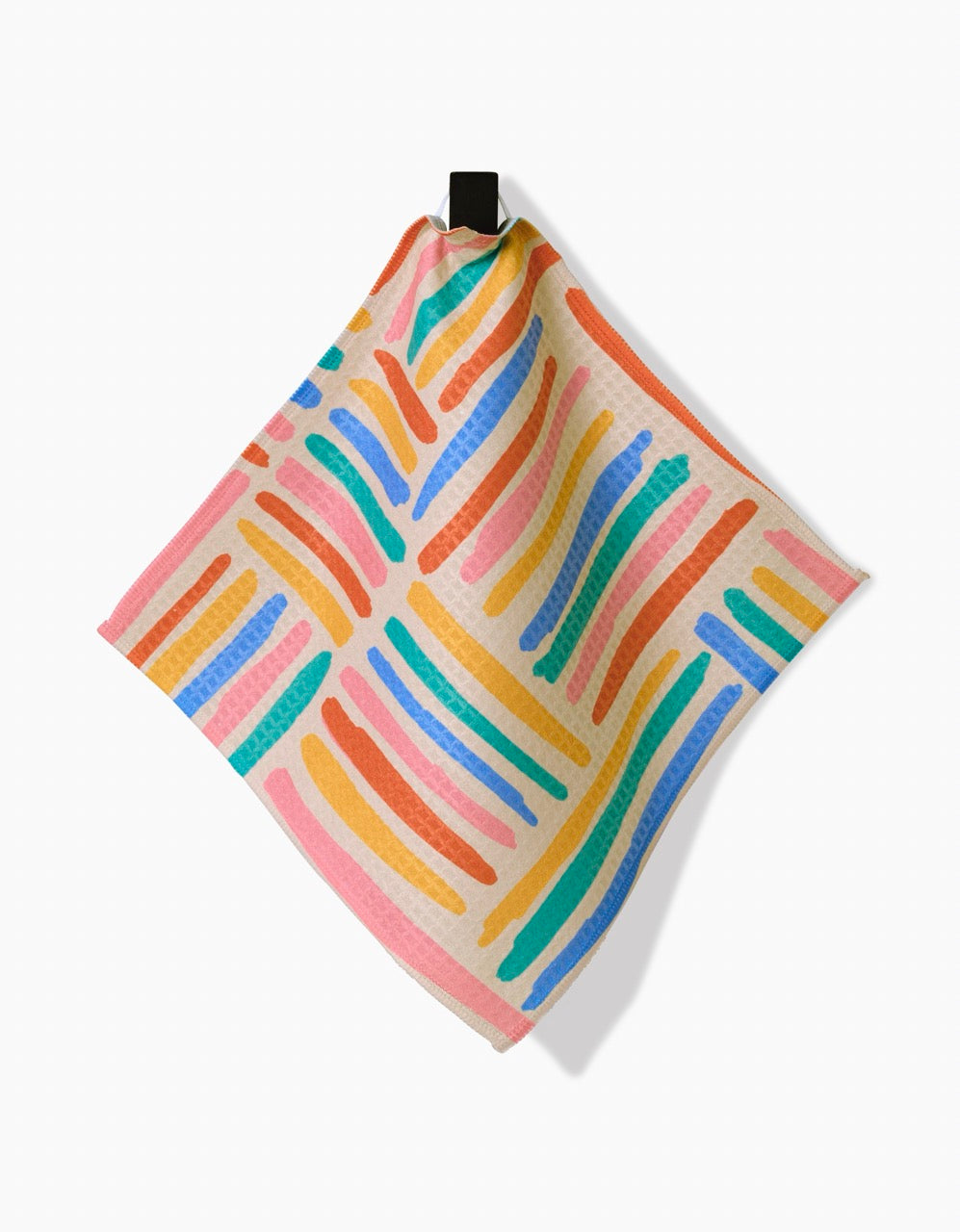 The Sareka Unique Pathways Luxe Washcloth features wavy, hand-painted stripes in pink, blue, orange, green, and yellow on white. Square-shaped with a black loop and ultra-absorbent Geoweave technology for superior performance.