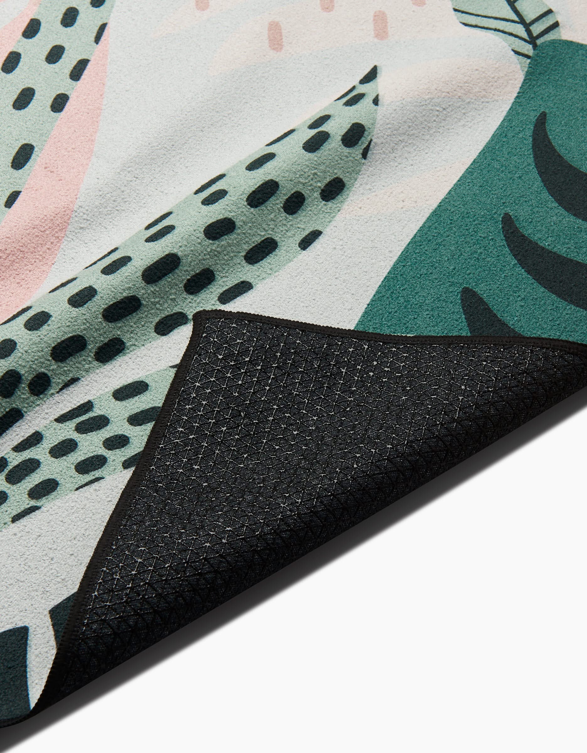 A close-up of the GEOMETRY Diedre yoga towel showcases its textured, slip-resistant fabric for enhanced stability and comfort.