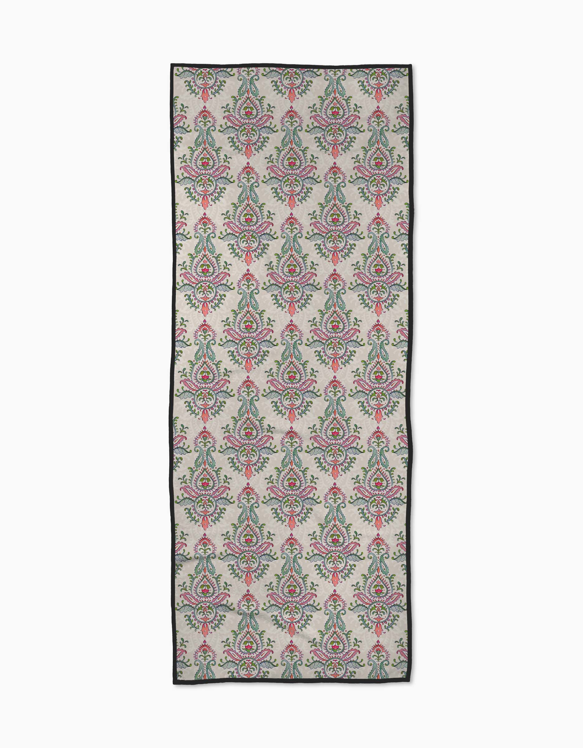 Memento by Maayan Alper-Swan: a rectangular recycled yoga towel with repeating floral and paisley patterns in pink, green, and blue on a light gray background, finished with a thin black border.