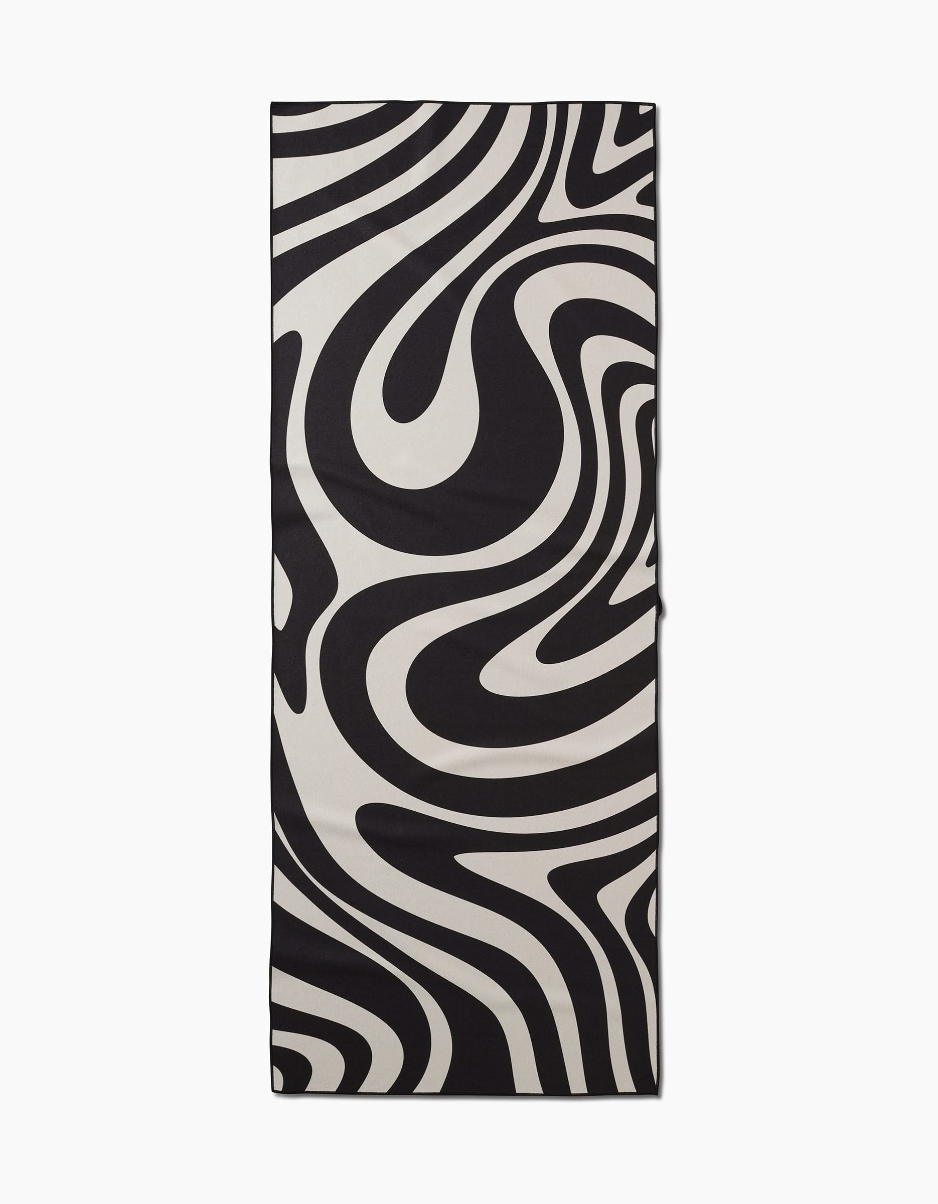 The GEOMETRY Spiral slip-resistant yoga towel is rectangular and features a bold black and white abstract swirl pattern reminiscent of wavy zebra stripes, shown laid flat on a white background.