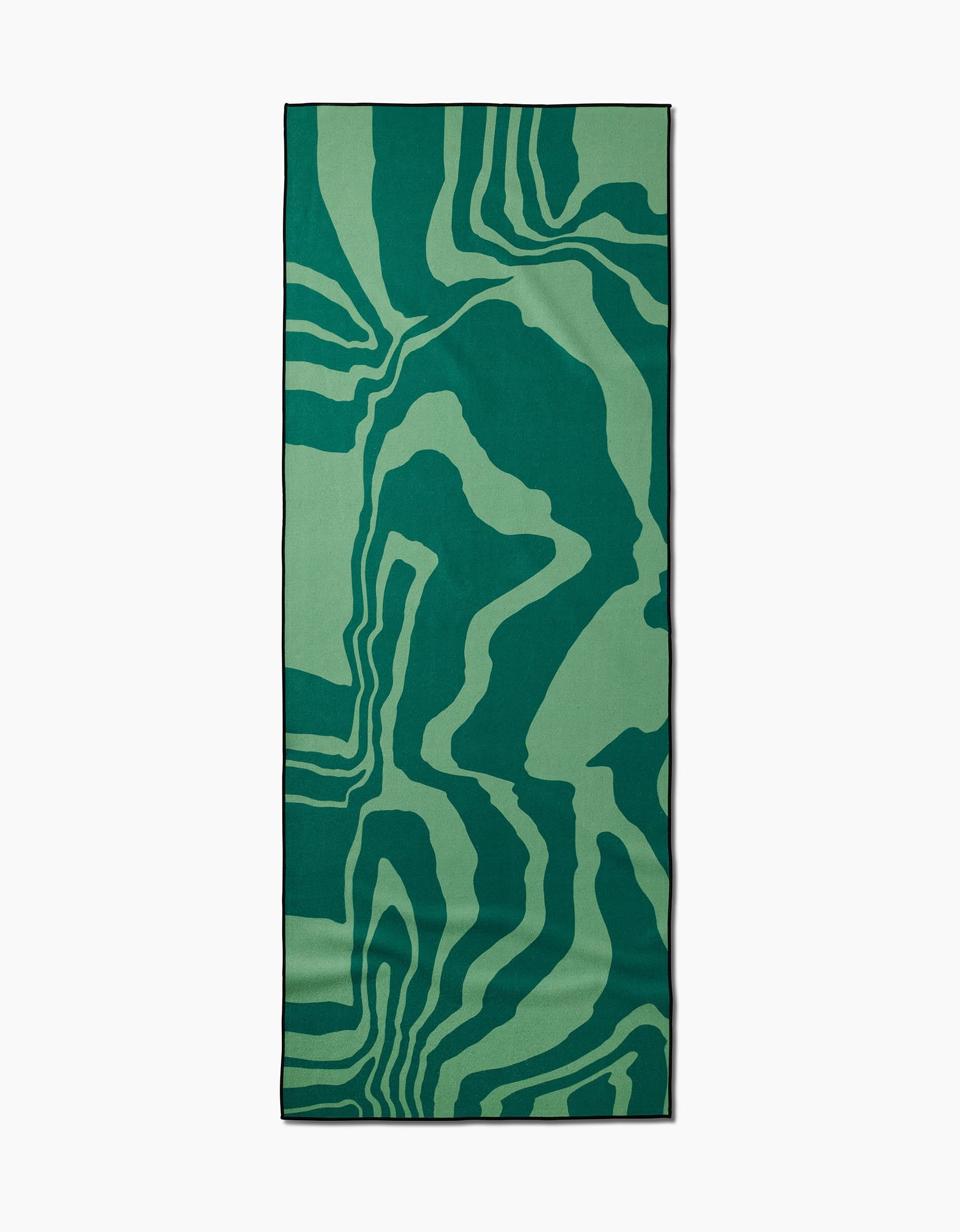 The GEOMETRY Watermelon Vibes yoga mat features an abstract, wavy green and dark green design inspired by nature, crafted from recycled materials.
