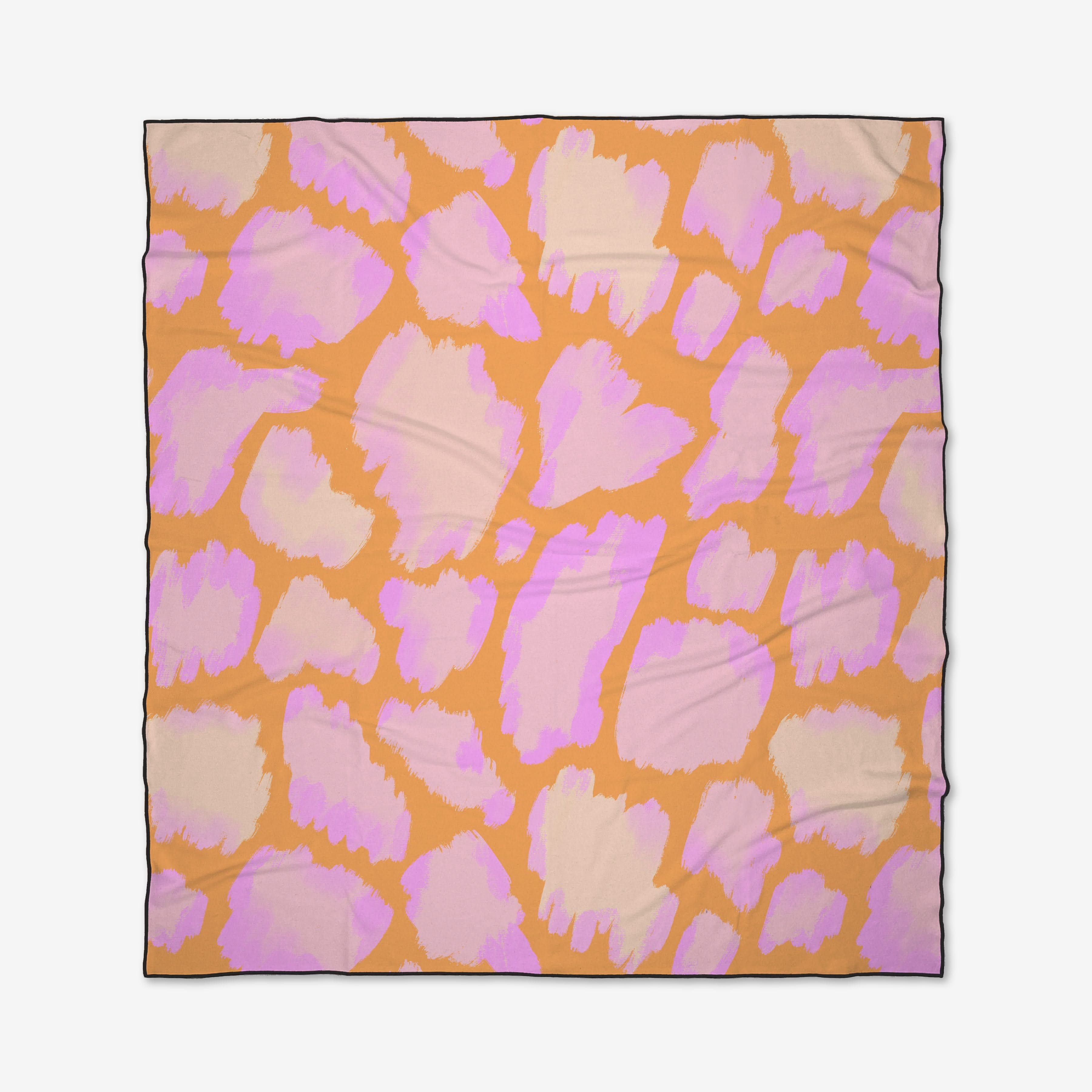 The Gentle Giraffe by Elisabeth Wing is a square scarf with an abstract animal print of large pink and beige spots on orange, made from quick-drying recycled materials.