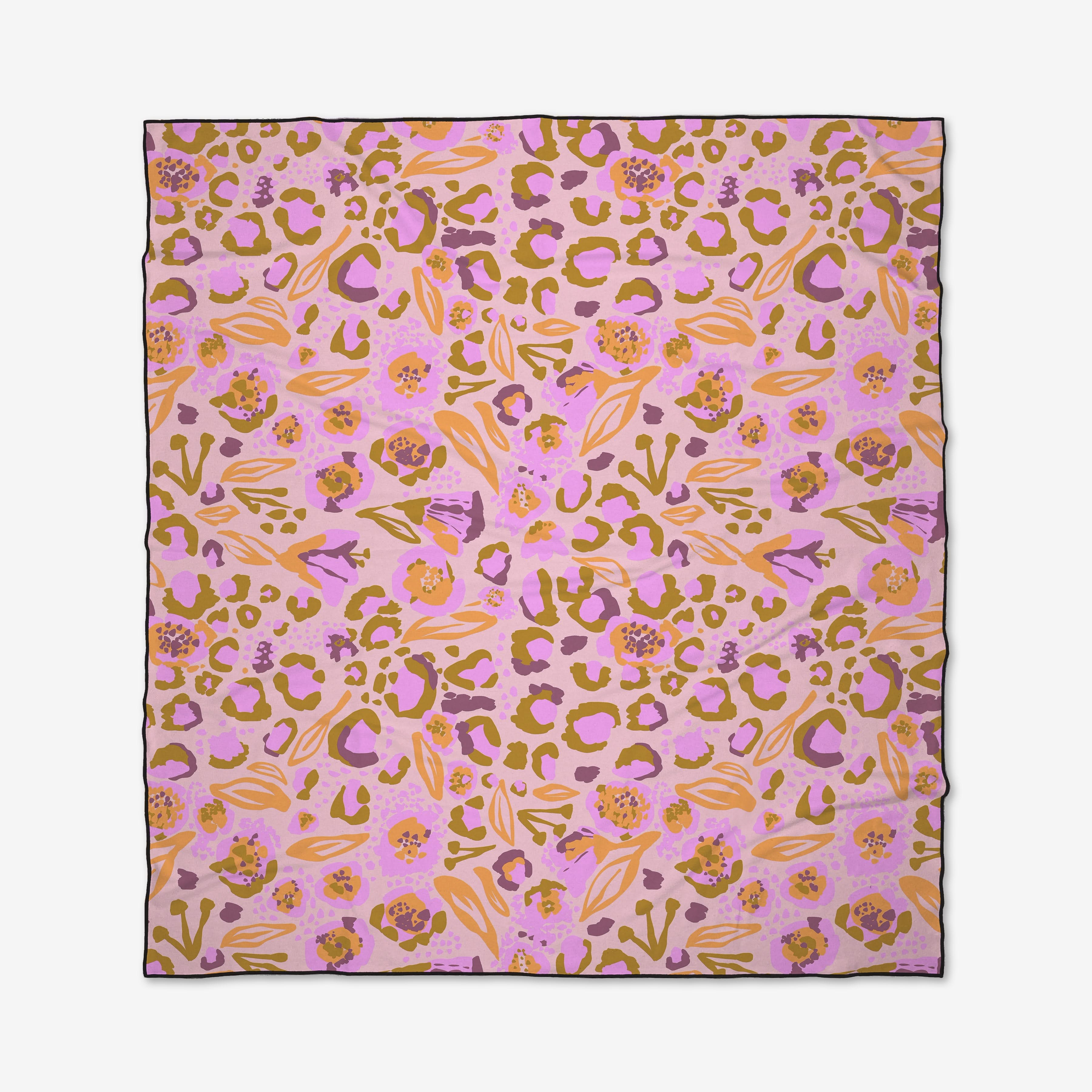 The Leopard Loving scarf by Elisabeth Wing features a pink base with abstract orange, yellow, and purple floral and animal prints. Made from recycled materials, it is finished with a thin dark border for added style.