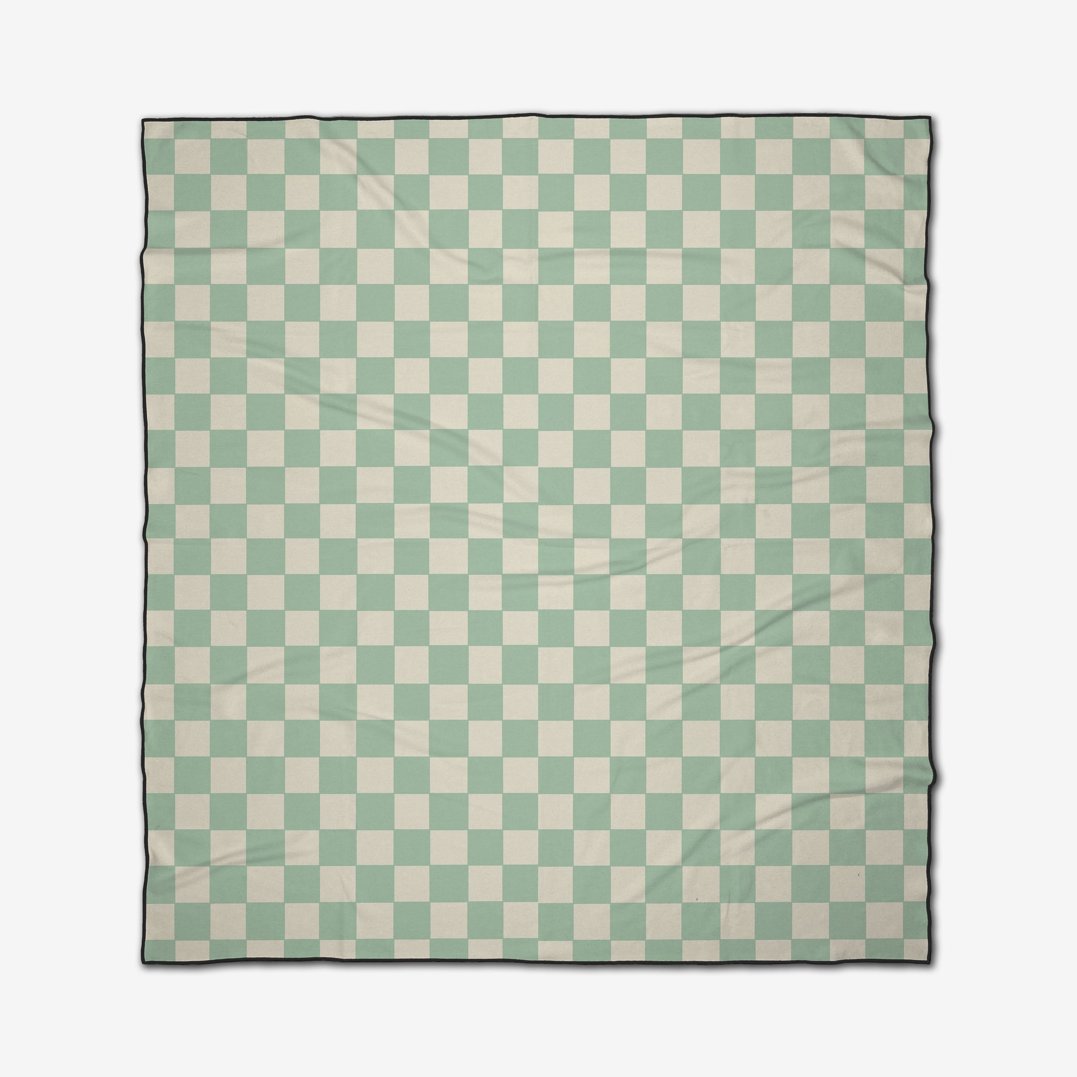 The GEOMETRY Mint Checker is a quick-drying Micro-loop Beach Blanket featuring a light green and white checkered pattern with a thin black border, shown lying flat with slight surface wrinkles.