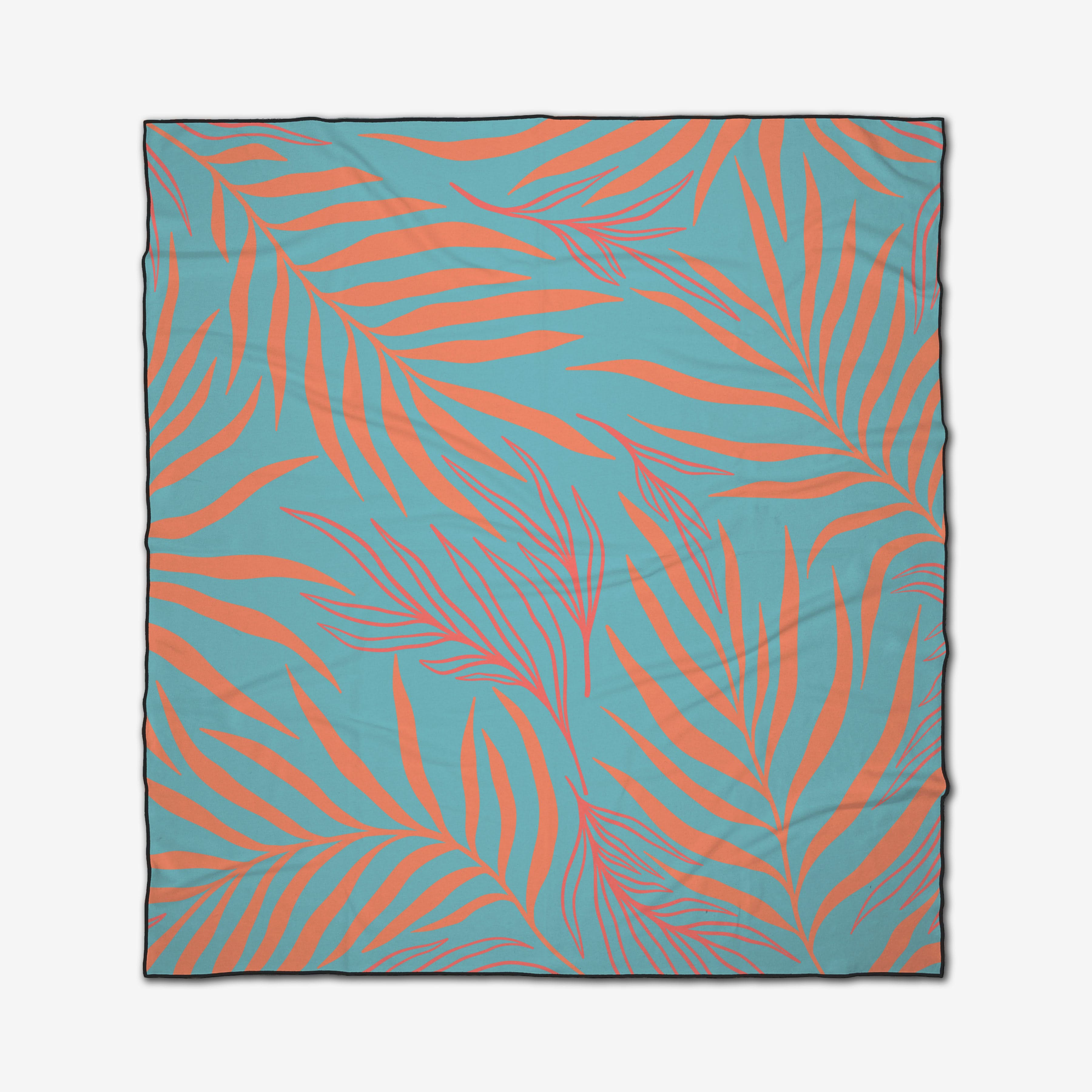 The GEOMETRY Palm Branches beach blanket features a quick-drying fabric with orange palm leaves in a stylized, overlapping pattern on a light blue background covering the entire surface.
