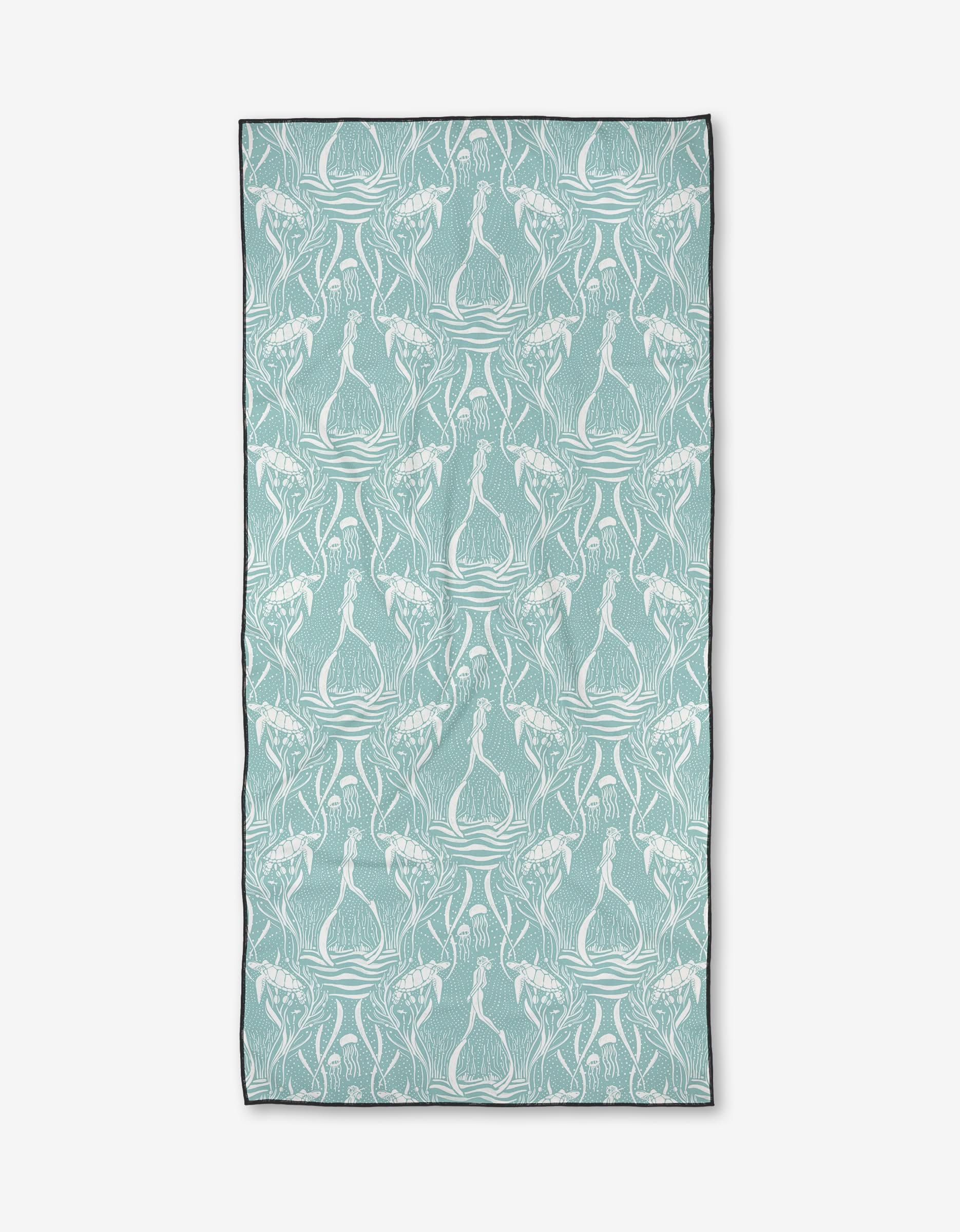 The Scuba Diver beach towel by Katie OShea is rectangular, quick-drying, and showcases white onions and leafy plants on light teal with a slim dark border for a stylish touch.