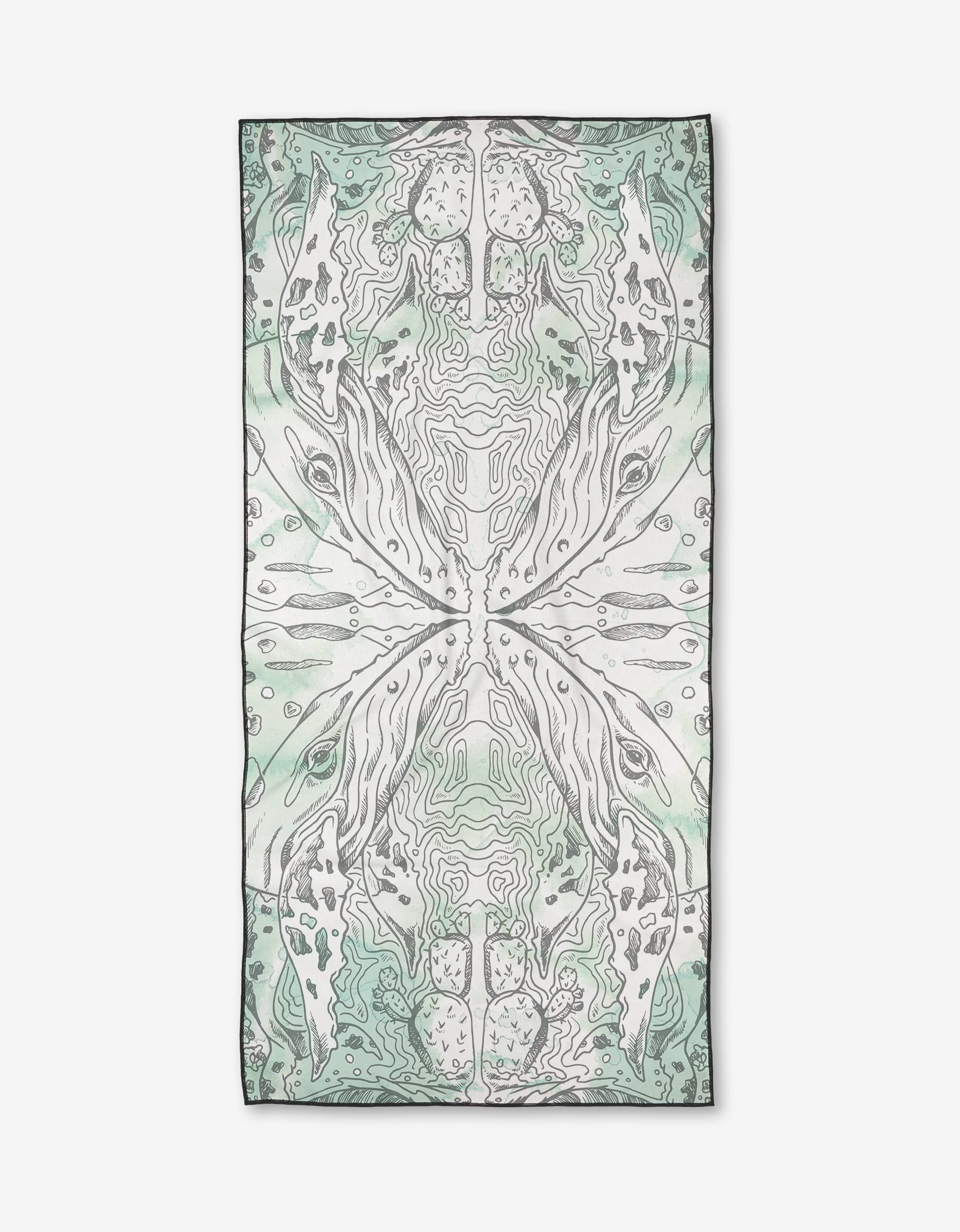 The Skye Walker Whale Micro-loop Beach Towel features a rectangular shape and an abstract, symmetrical design in soft green, grey, and white tones. Made from post-consumer recycled materials, it is shown laid flat on a white background.