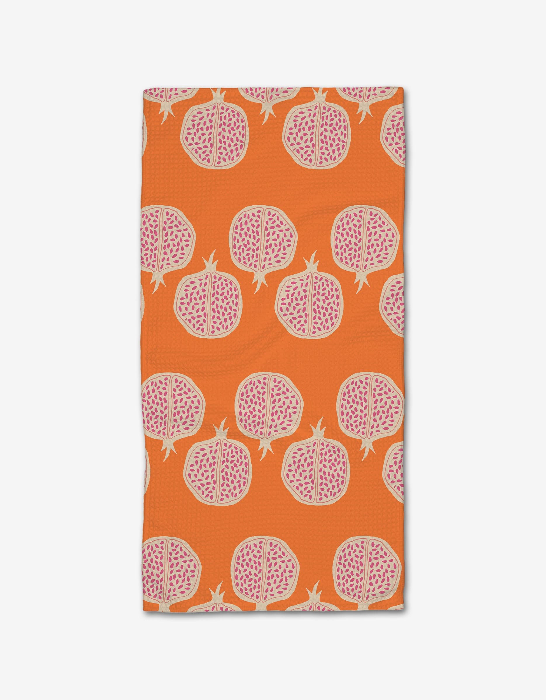 The Pomegranate Parade bar towel by Lizzie Clark features a vibrant orange Geoweave fabric with a repeating motif of halved pomegranates in pink and white.