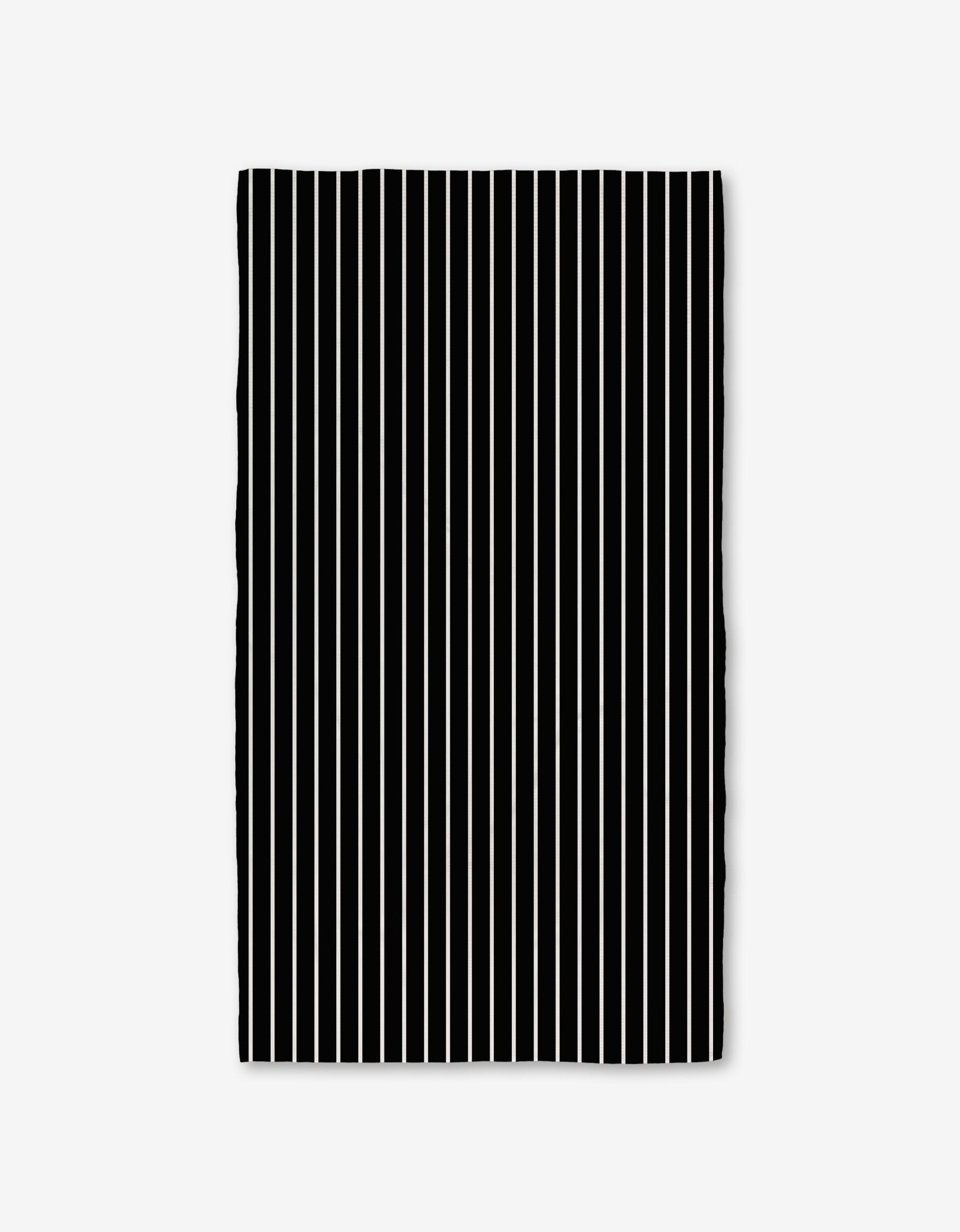 The GEOMETRY Black Linen Bath Towel features evenly spaced vertical black and white stripes on a plain white background, with slightly wavy edges that highlight its ultra-absorbent Geoweave technology.
