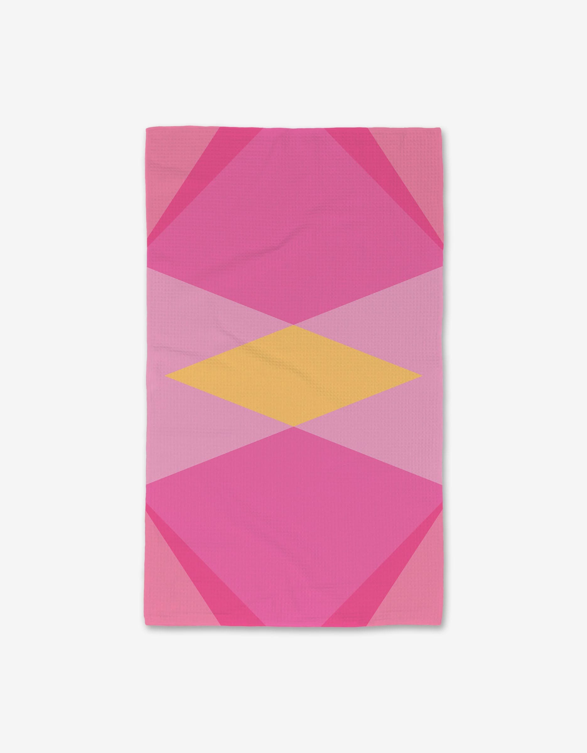 The GEOMETRY Electric Pink blanket features overlapping pink and magenta triangles with a central yellow diamond on a white background, crafted with Geoweave technology for ultra-absorbency.