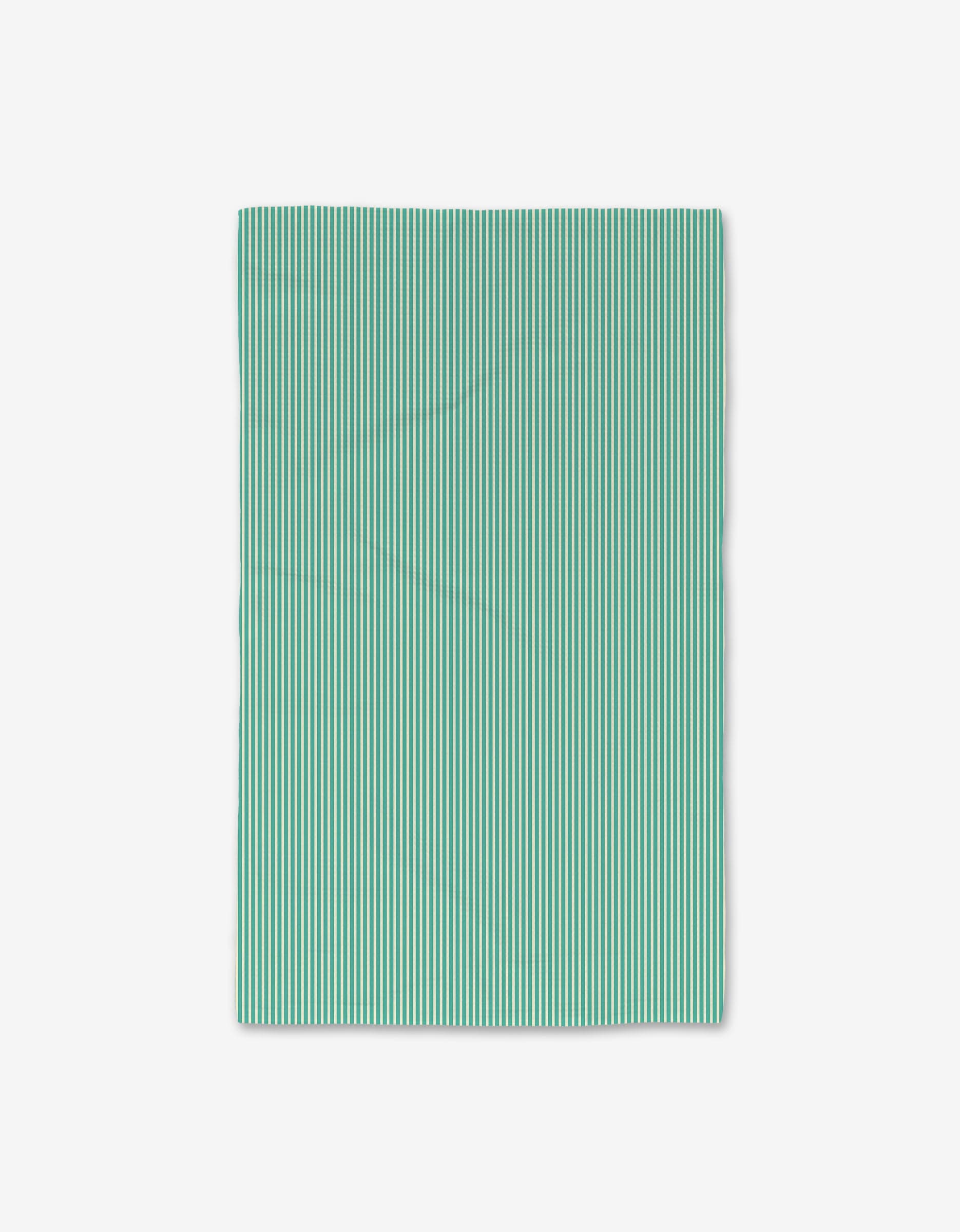 The GEOMETRY Half And Half Hand Towel is rectangular with evenly spaced vertical teal and white stripes, shown flat on a white background; ultra-absorbent and quick-drying for daily use.