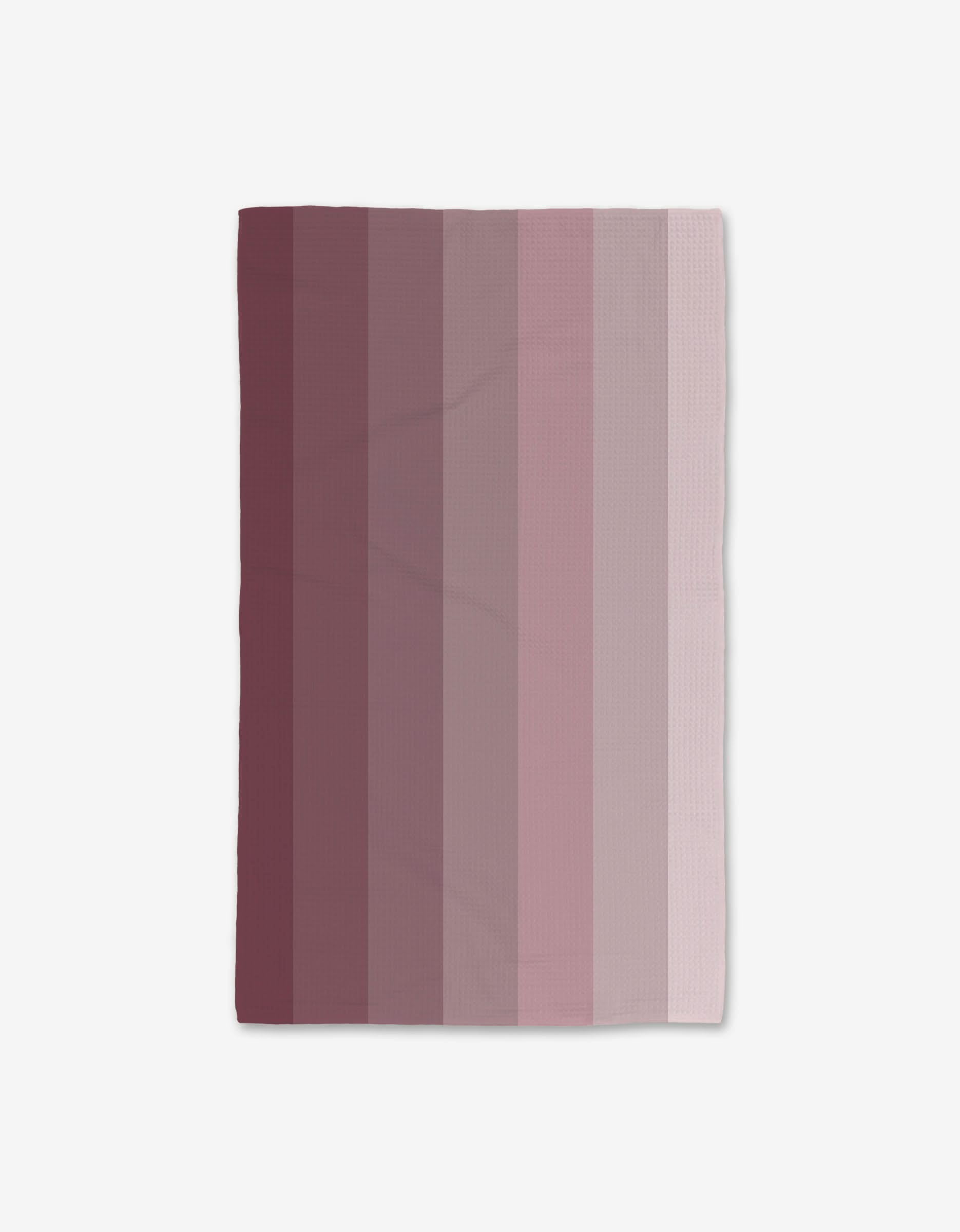 The Mauve Levels blanket by GEOMETRY features vertical stripes in shades of mauve, burgundy, and blush pink—from darkest to lightest—set on a white background and made from recycled materials.