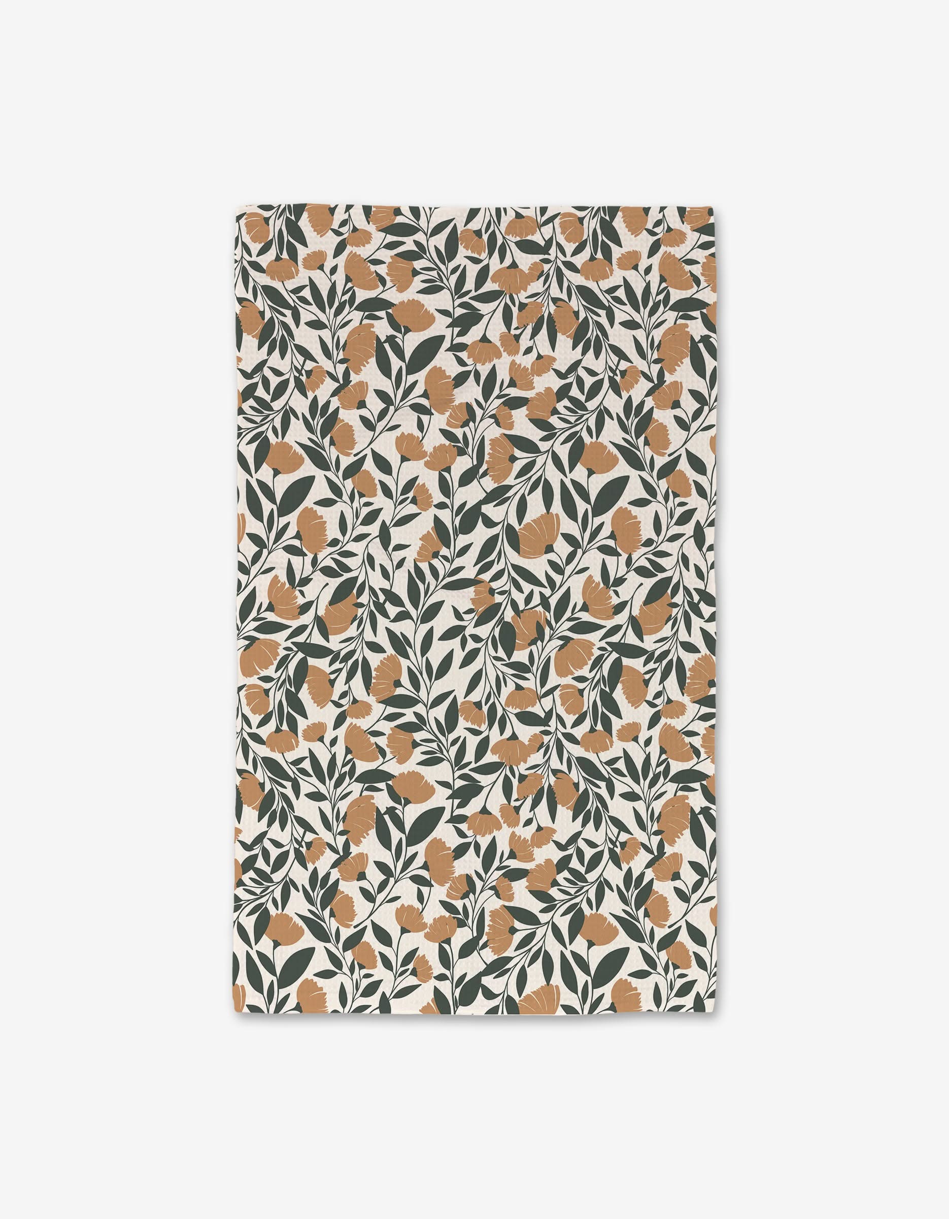 The Naomi hand towel by Charlie Rowan Designs is rectangular with a dense, symmetrical all-over orange floral and dark green leaf pattern on off-white. Ultra-absorbent and quick-drying for everyday luxury.
