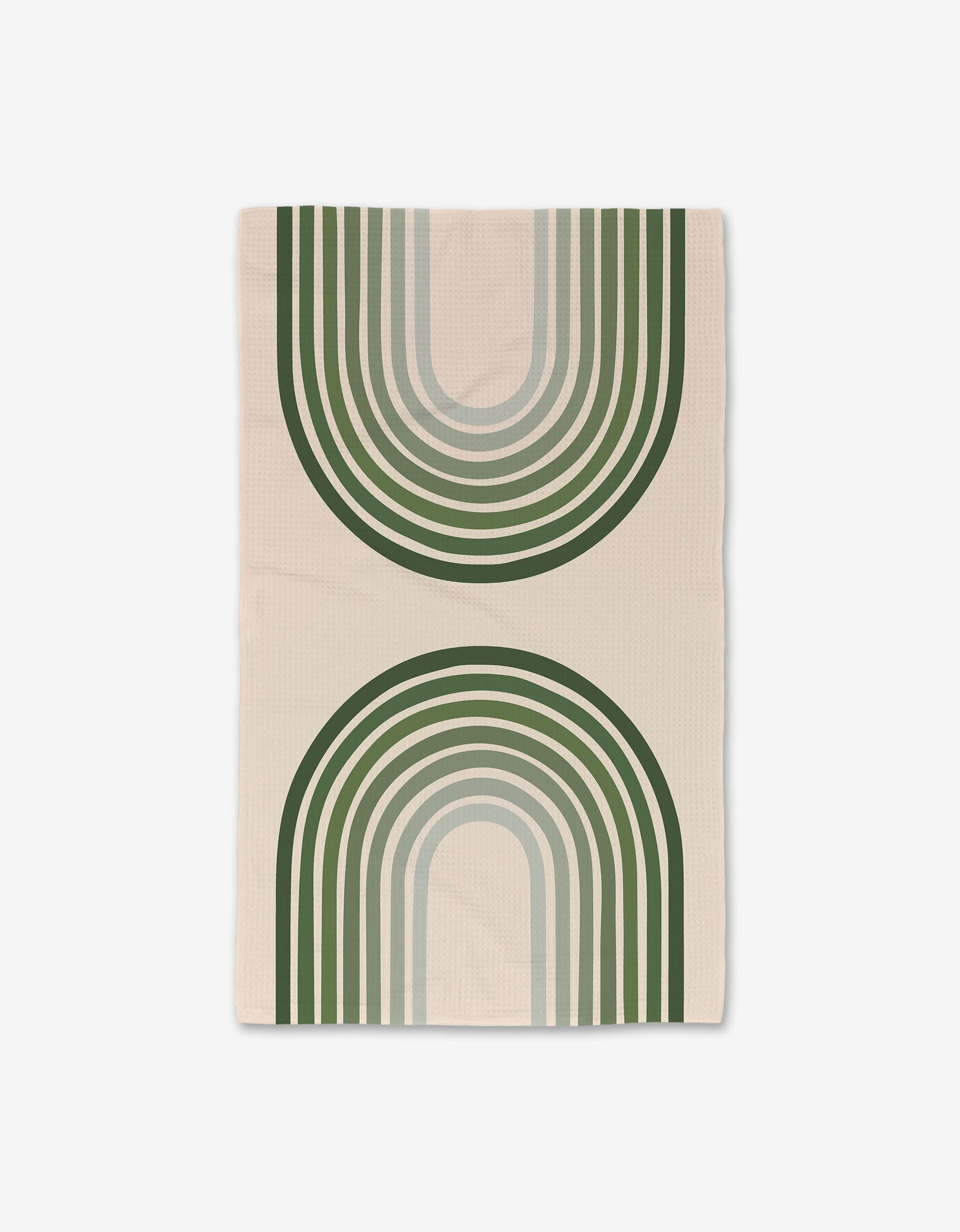 The Olive Arches blanket by GEOMETRY features large overlapping green and gray arches with striped accents on a beige background, creating a modern geometric design. Made from recycled materials.