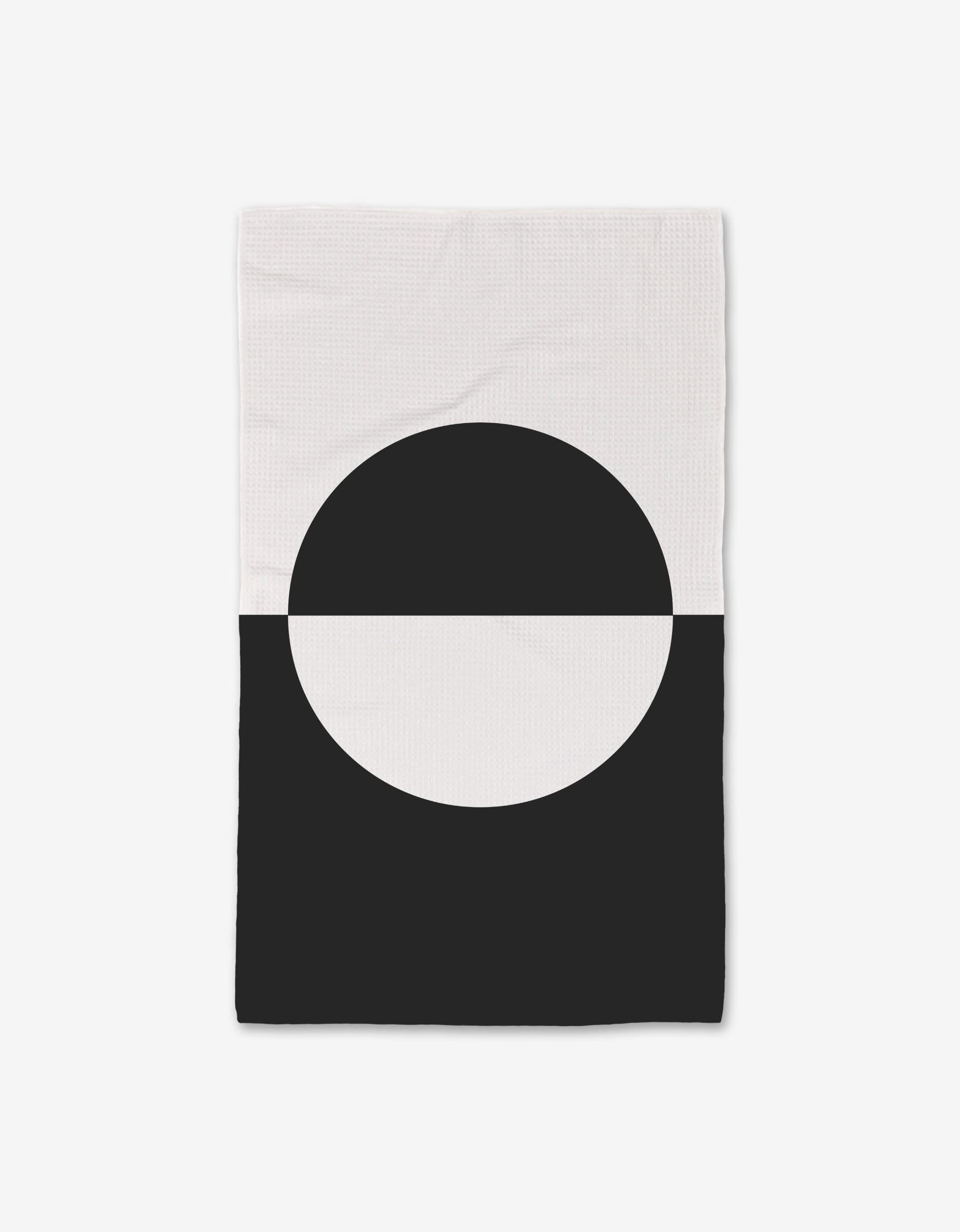 The GEOMETRY Yin Yang towel is a rectangular, ultra-absorbent Luxe Hand Towel with a minimal design: a split black and white circle for modern style.