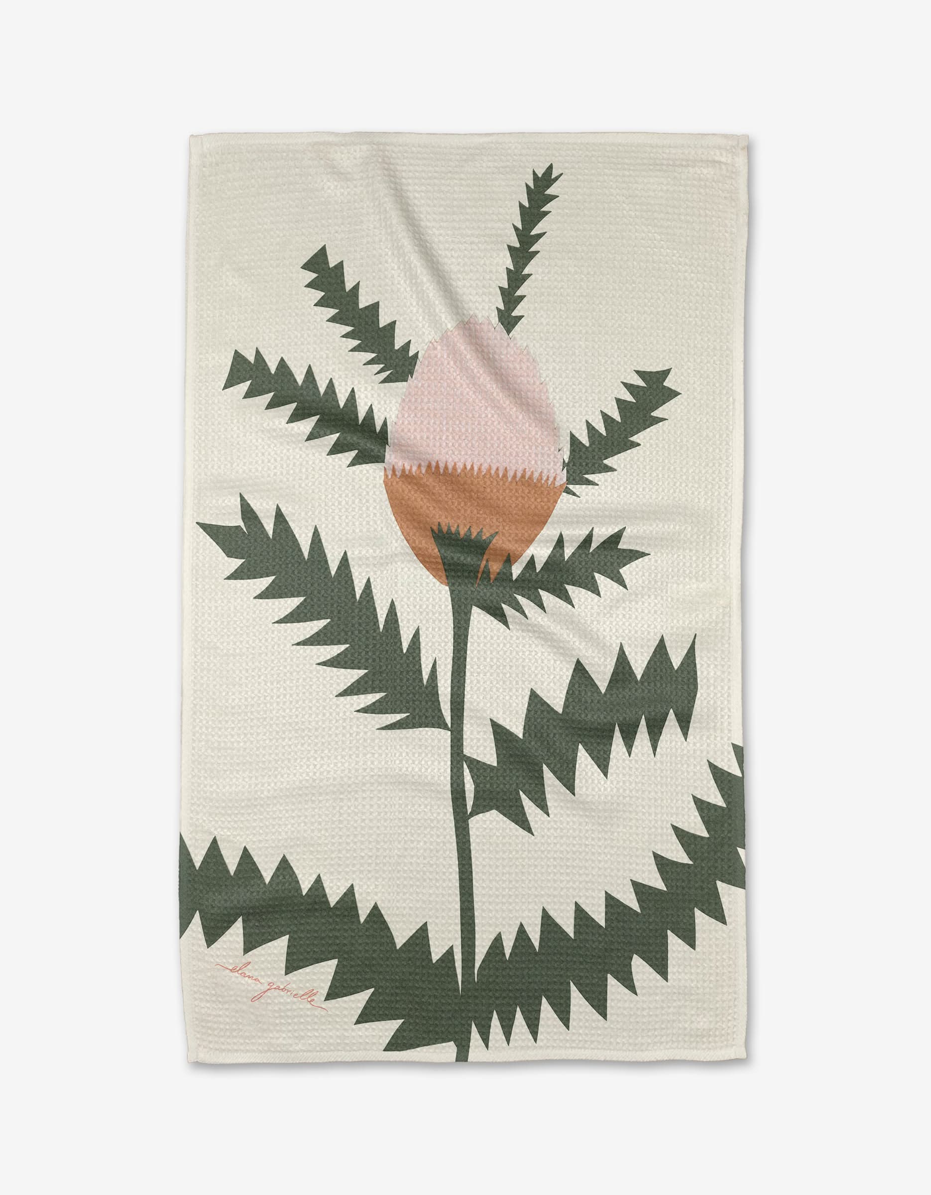 The Along the Path tea towel by Elana Gabrielle features a stylized flower with jagged green leaves and a large pink-brown bud on beige; this absorbent towel brings charm and function to any kitchen.