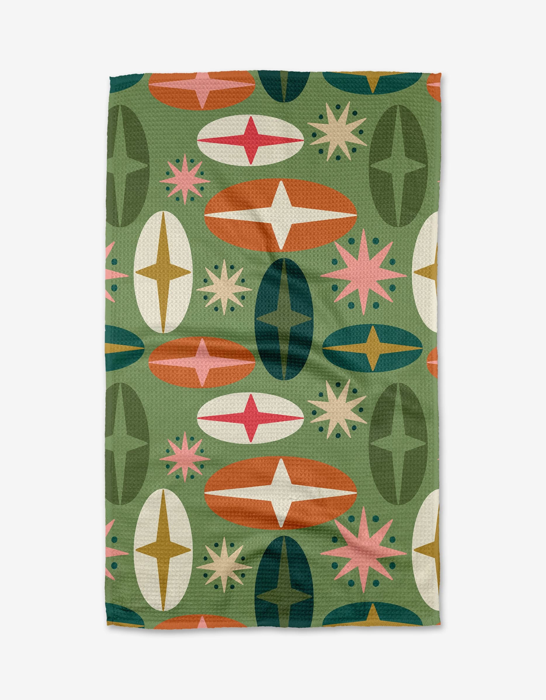 The Bauble tea towel by Rebecca Woolbright features a retro geometric pattern with green, orange, pink, and cream ovals plus starbursts on green. Made from ultra-absorbent recycled materials for a stylish, sustainable kitchen.