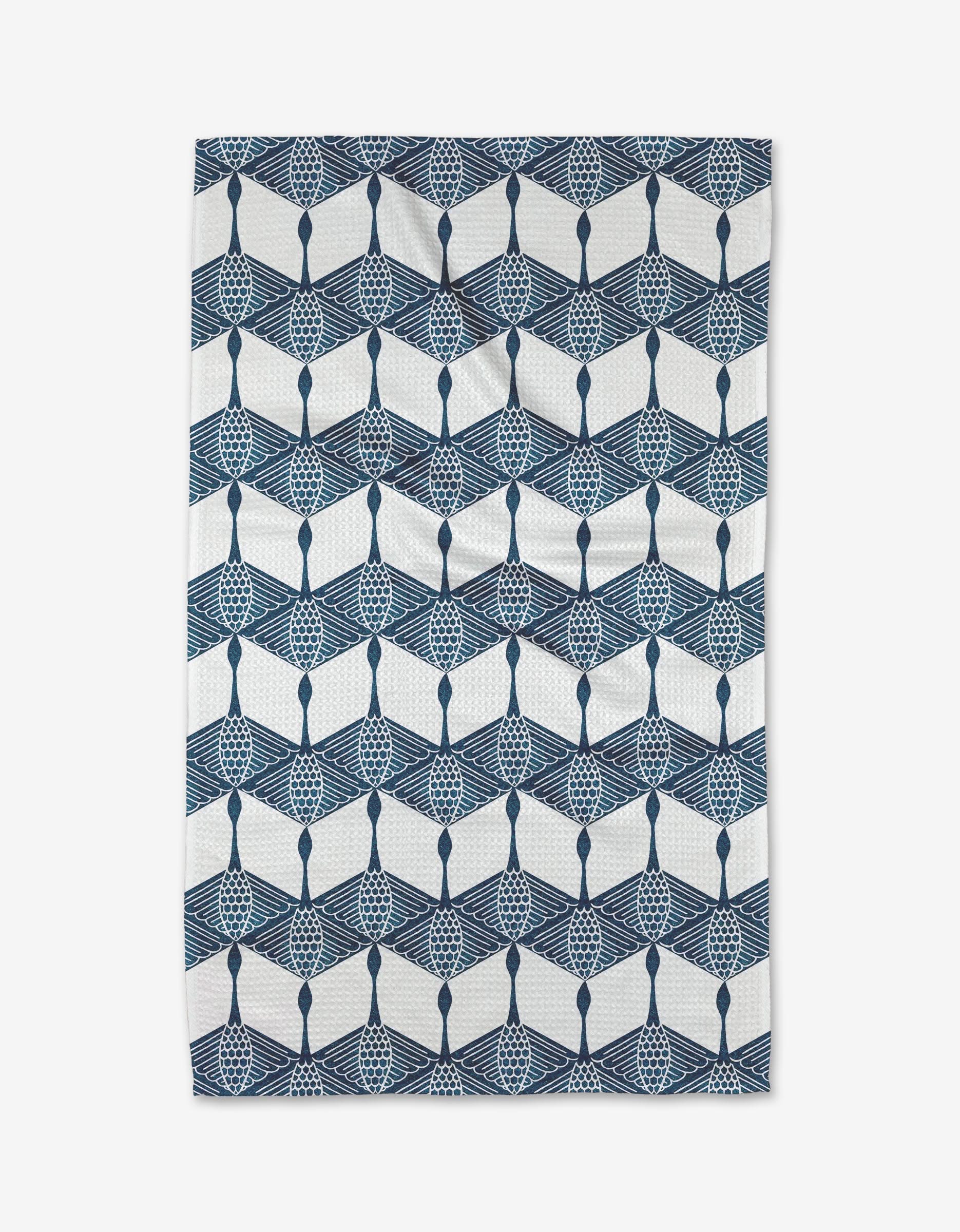 The Renee Fly BB Cubed tea towel showcases a geometric pattern of interlocking blue shapes in a hexagonal leaf or fan design on white, crafted from durable Geoweave fabric.