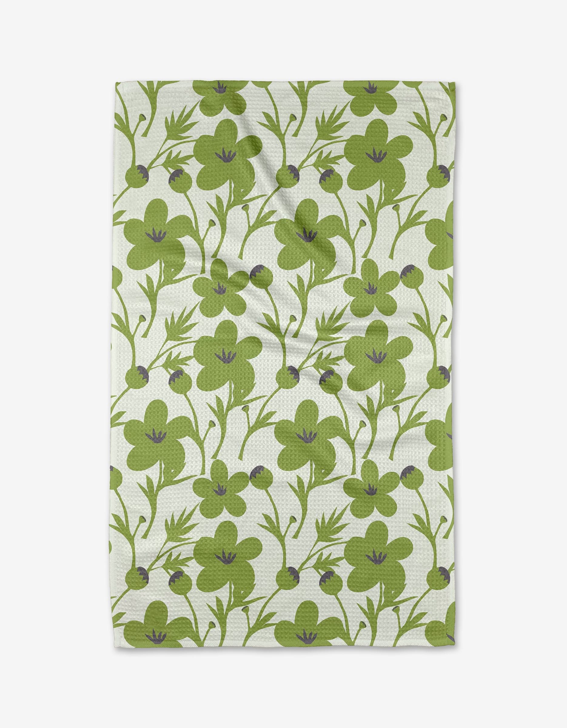 The Blooming Blossoms tea towel by Lizzie Clark showcases large green flowers with purple centers, slender stems, and scattered leaves on white Geoweave fabric—crafted from recycled materials for an eco-friendly touch.