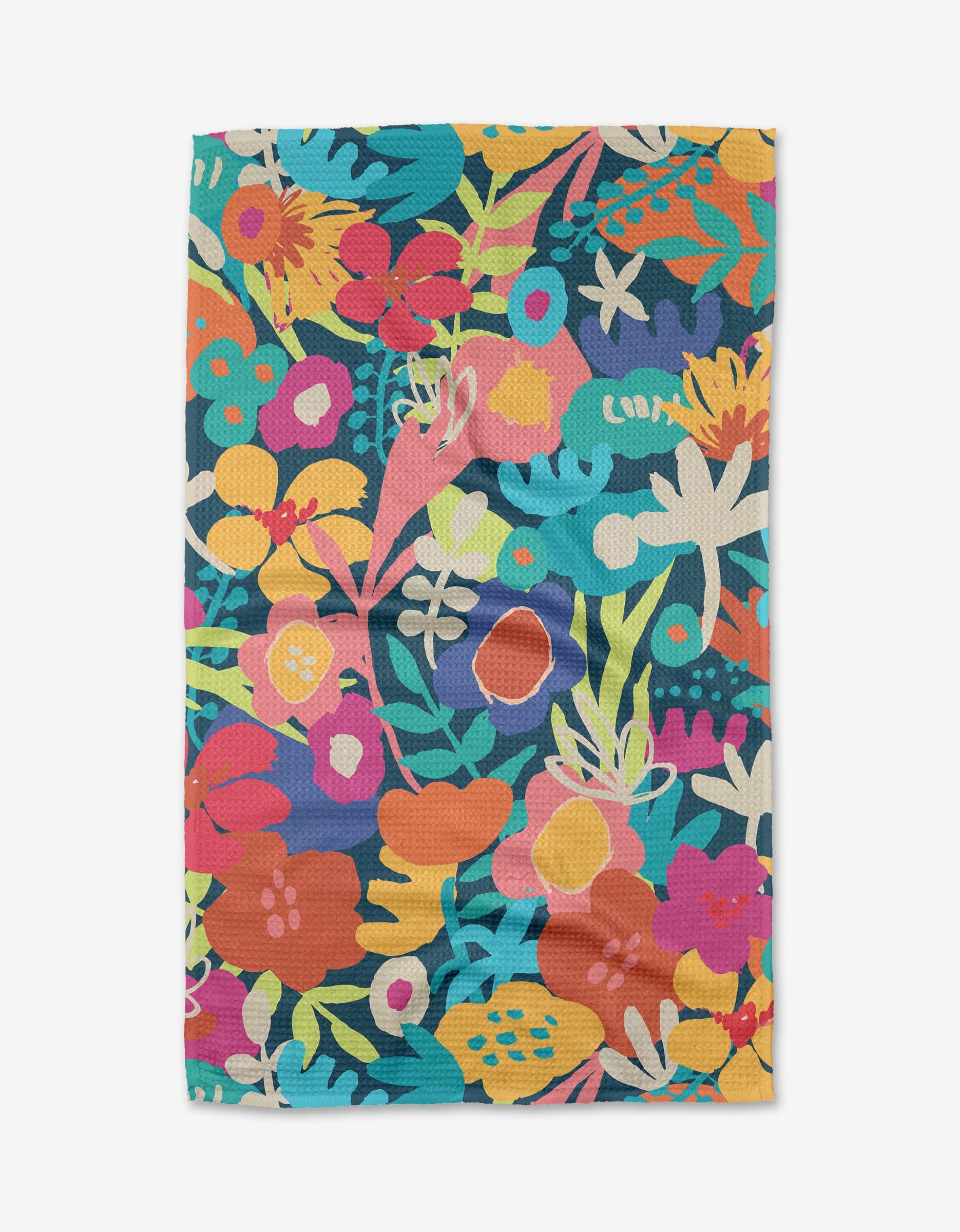 The Bright Bunch Tea Towel by Sareka Unique is a rectangular Geoweave™ towel with a vivid floral pattern featuring multicolored flowers and leaves in pink, orange, yellow, blue, green, and white on a dark background.