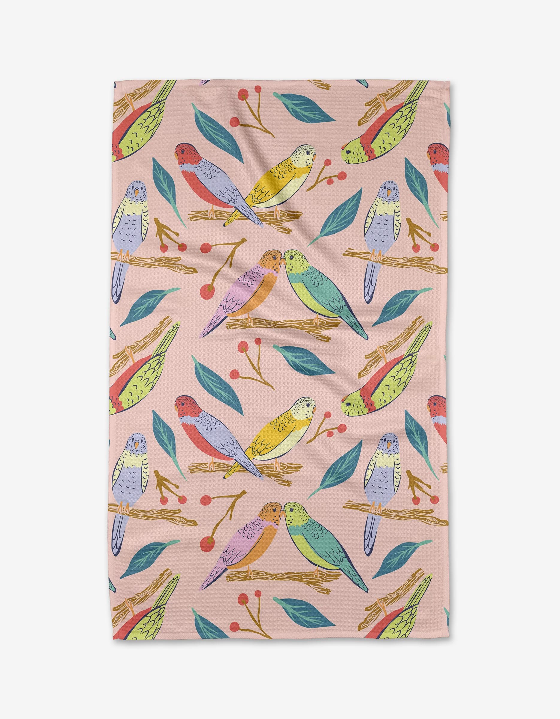 Berries and Budgies by Elisabeth Wing is a pastel pink Geoweave cloth featuring colorful birds on branches with green leaves and red berries.