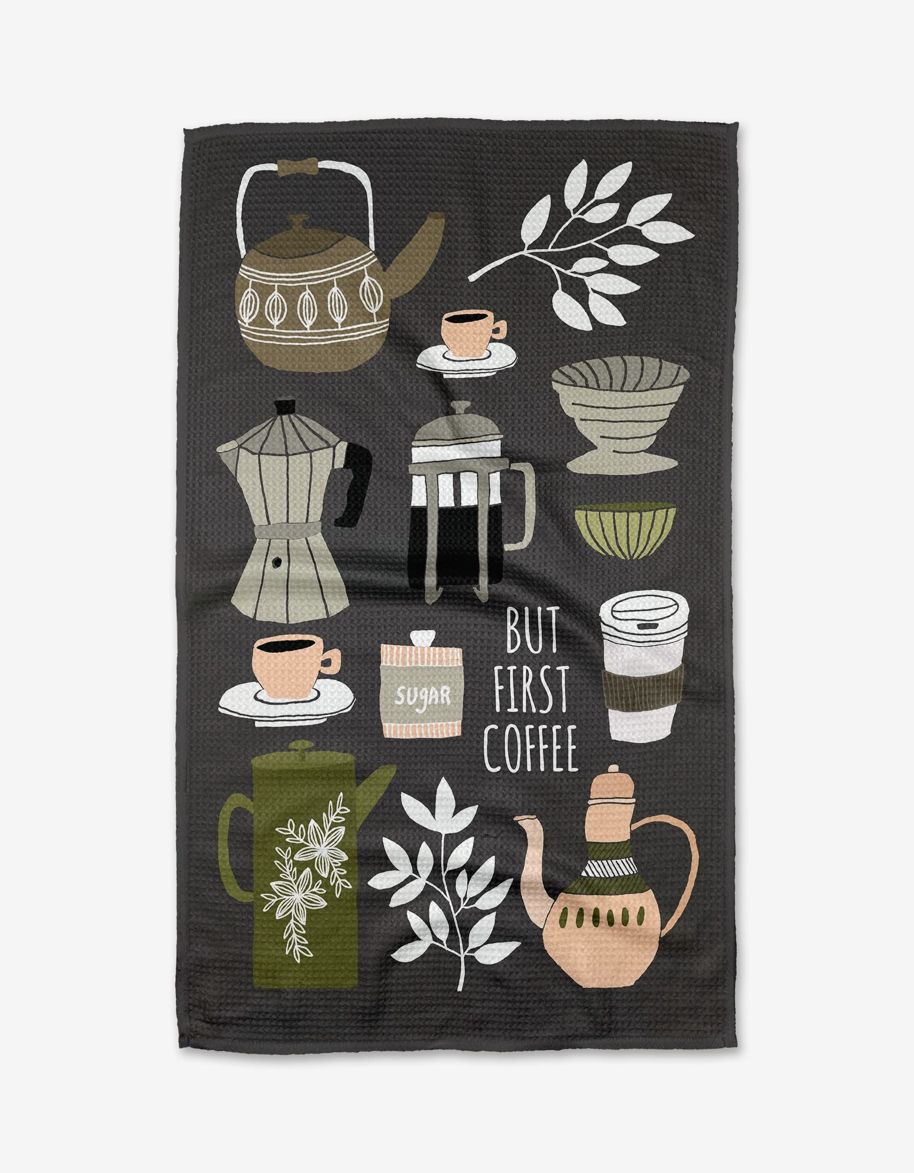 The But First, Coffee tea towel by Cottonflower Studio showcases coffee makers, cups, leaves, and the phrase BUT FIRST COFFEE on a dark background, made with absorbent Geoweave fabric—perfect for everyday use.