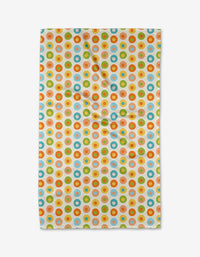 The Mindfulnice Candy Dots towel features a vibrant pattern of orange, blue, green, and yellow dots on soft, ultra-absorbent Geoweave fabric. Slightly wrinkled, its displayed against a plain white background.