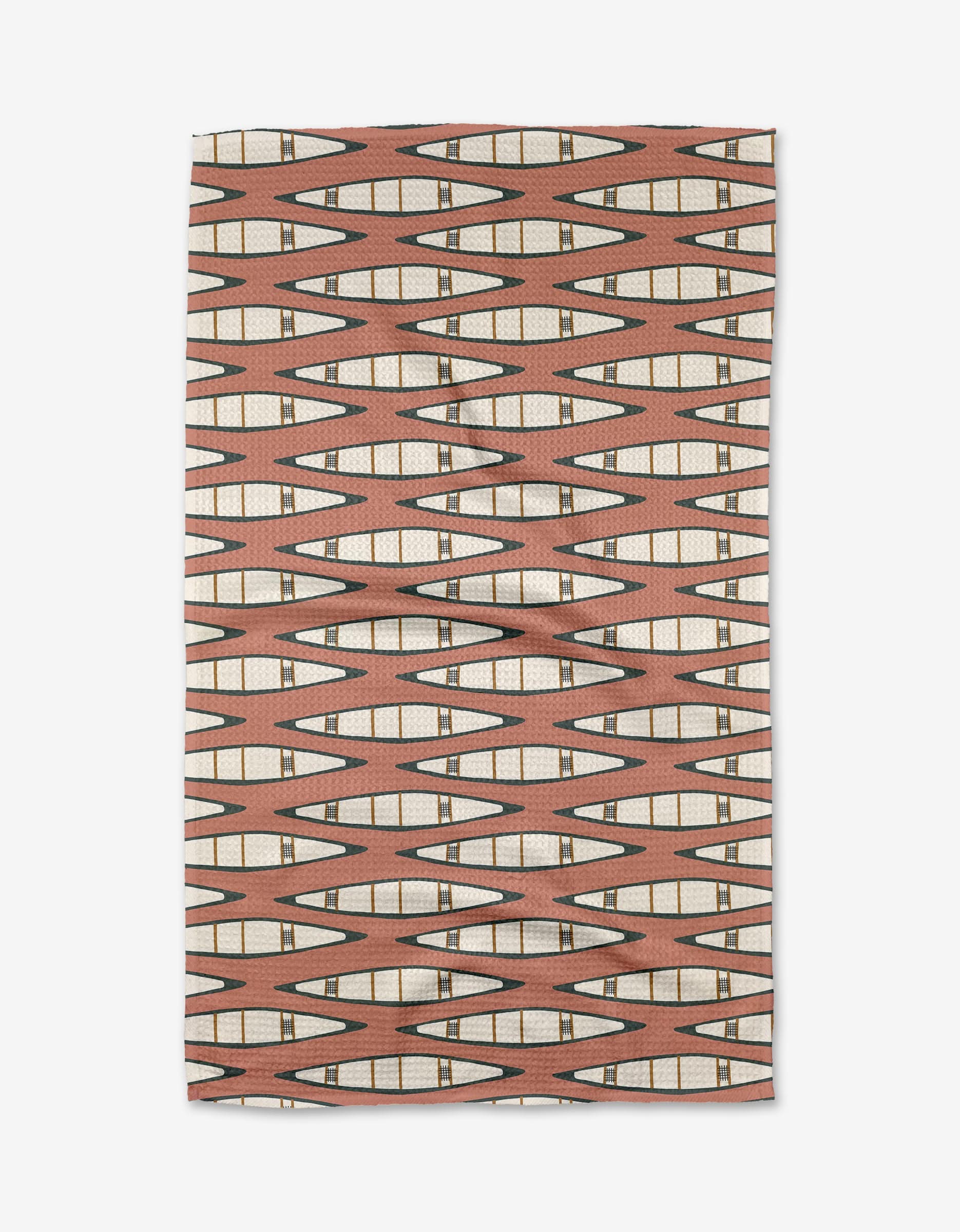 The Coit Creative Canoes Tea Towel features a geometric pattern of elongated diamonds in brown, cream, and black on light brown. Made from recycled materials, its symmetrical design covers the entire rectangular fabric.