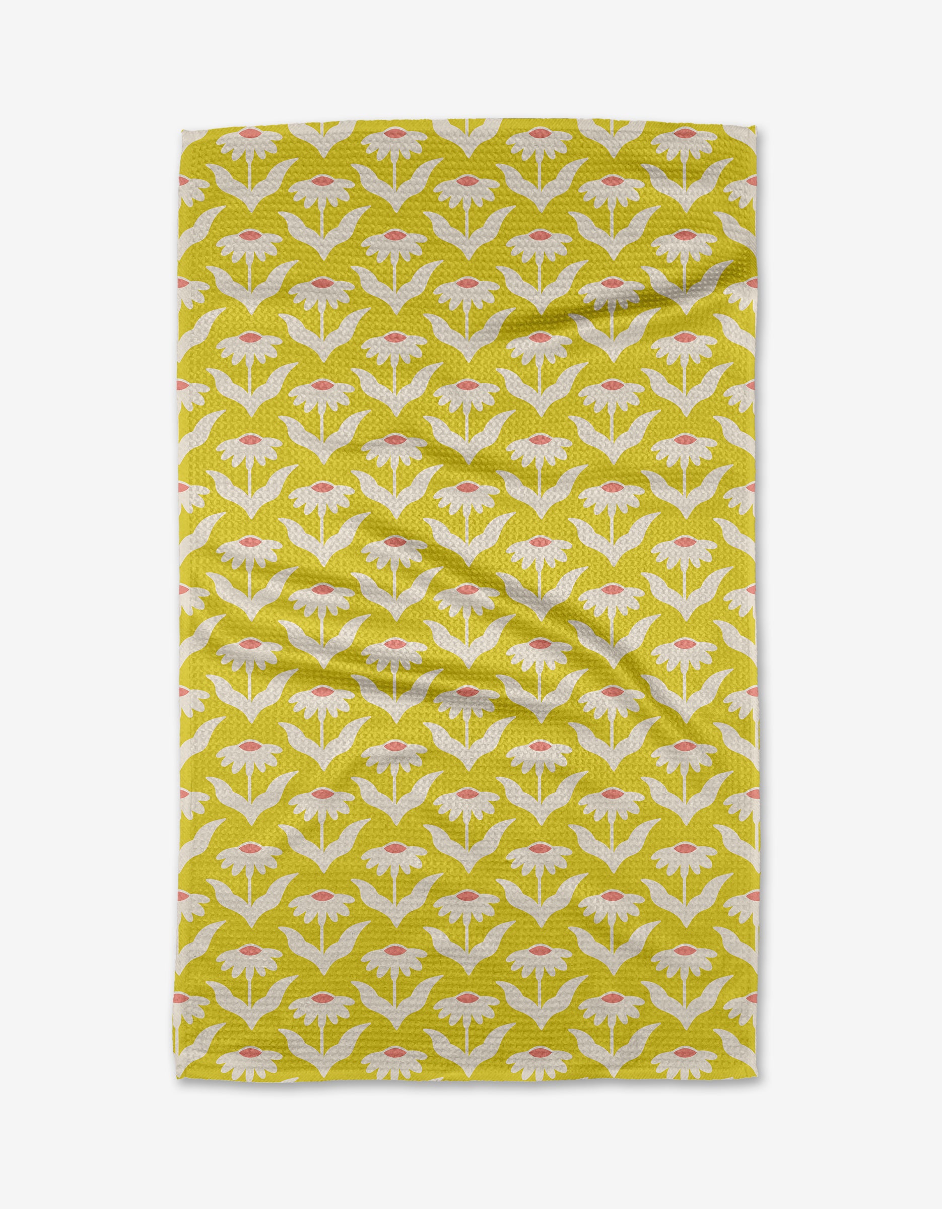 The Kayla Ann Coneflower tea towel is yellow and rectangular, made from recycled materials. It features neat rows of white and pink stylized moths or flowers on Geoweave fabric and is shown slightly wrinkled on a white background.
