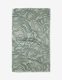 The Twig + Spark Depth Chart tea towel is light grey and rectangular, featuring a dark green abstract topographic line pattern, and is crafted from ultra-absorbent recycled materials.
