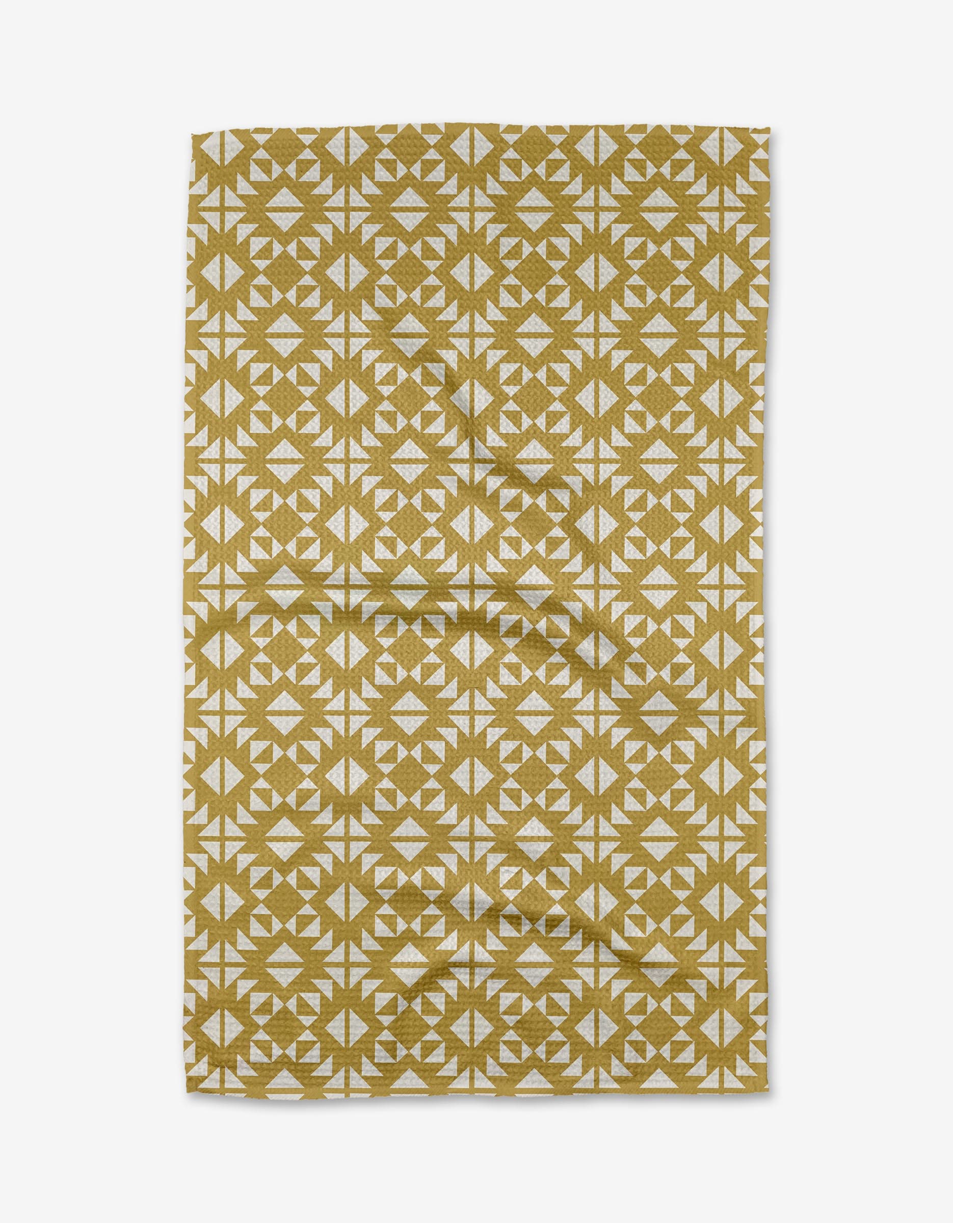 The Ash Cascade Desert Geo recycled kitchen towel features a mustard yellow and white geometric pattern with repeating circles and triangles, shown laid flat on a white background.