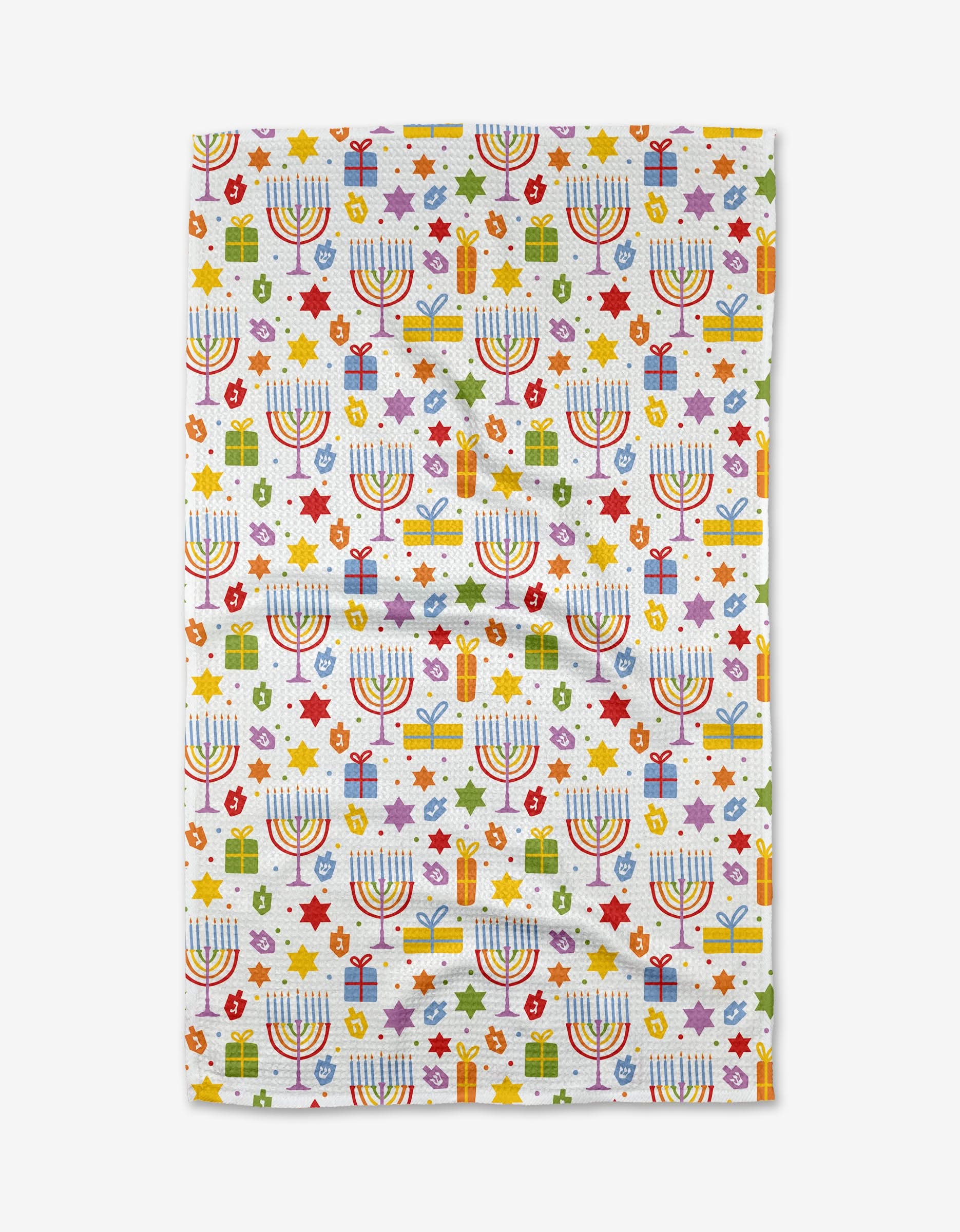 Brighten your holiday with the Hanukkah Oh Hanukkah towel by Mindfulnice—a colorful, ultra-absorbent tea towel featuring menorahs, dreidels, Stars of David, oil jars, and gifts—perfect for festive kitchen decor.