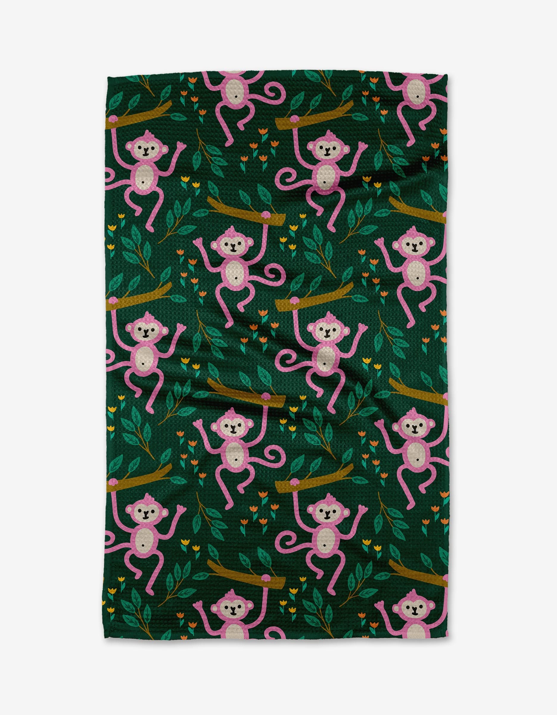 The Monkeys tea towel by Genna Blackburn features pink monkeys on brown branches, green leaves, and yellow flowers in a playful pattern. Made from durable Geoweave fabric, it adds fun to any kitchen decor.