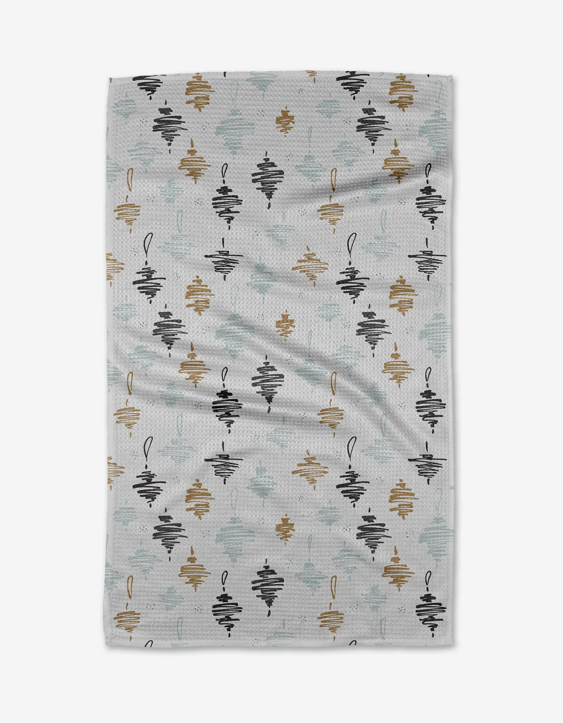 The Ornament blanket by Toboggan Avenue features a white textured design with abstract diamond-shaped clusters in black, gold, and light blue. Crafted with care for quick drying, it offers both style and practicality in any setting.