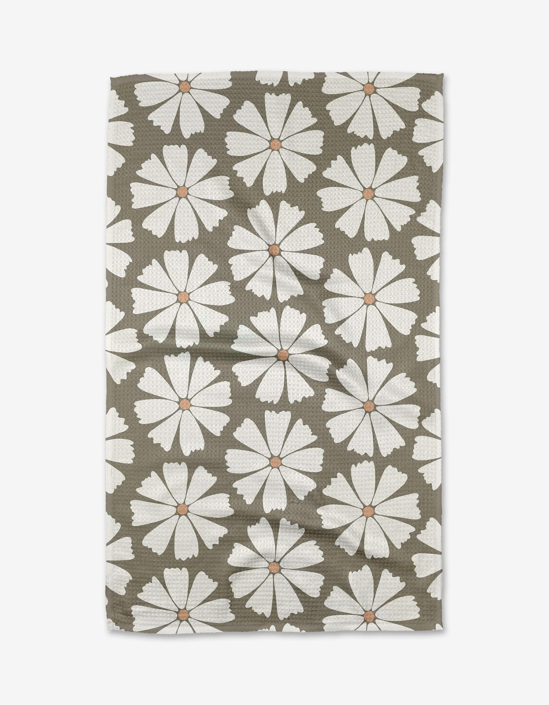 Retro Daisy by Hufton Studio is a rectangular tea towel crafted from recycled materials, featuring large white daisies with orange centers on an olive green background and a subtly textured, wrinkled finish.
