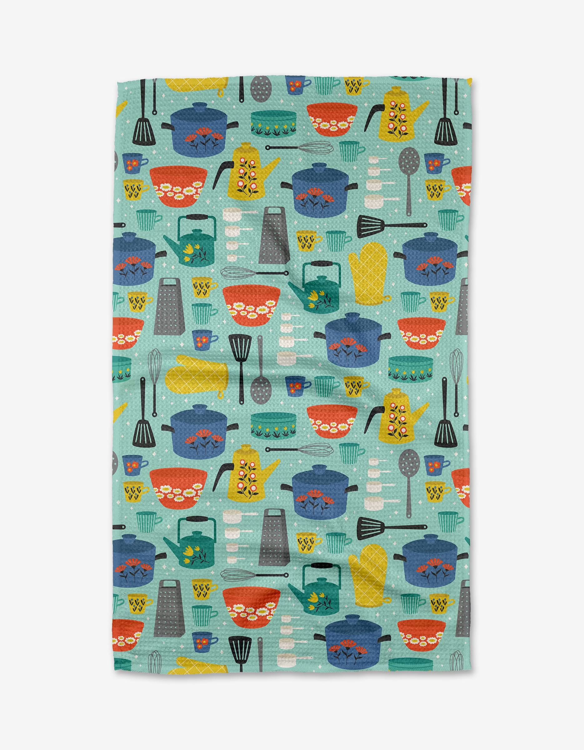 The Megan Kampa Retro Kitchen Tea Towel features Geoweave fabric and a playful teal design with pots, pans, bowls, whisks, and graters in red, blue, yellow, and gray—ideal for brightening your kitchen décor.