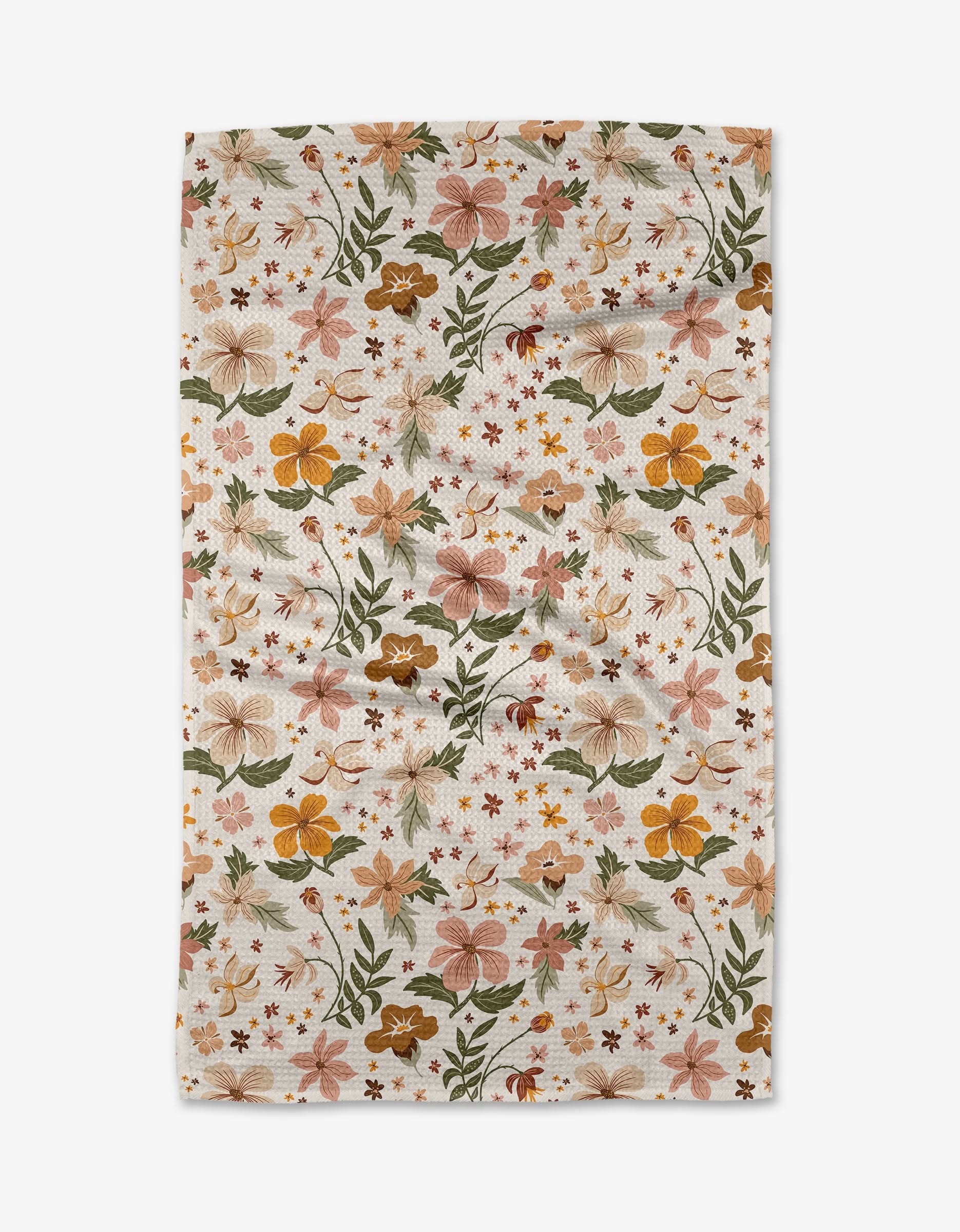 The Danelys Sidron Spring In Devon is a rectangular white cloth of ultra-absorbent Geoweave fabric, decorated with a colorful floral pattern in orange, yellow, pink, and green flowers and leaves.